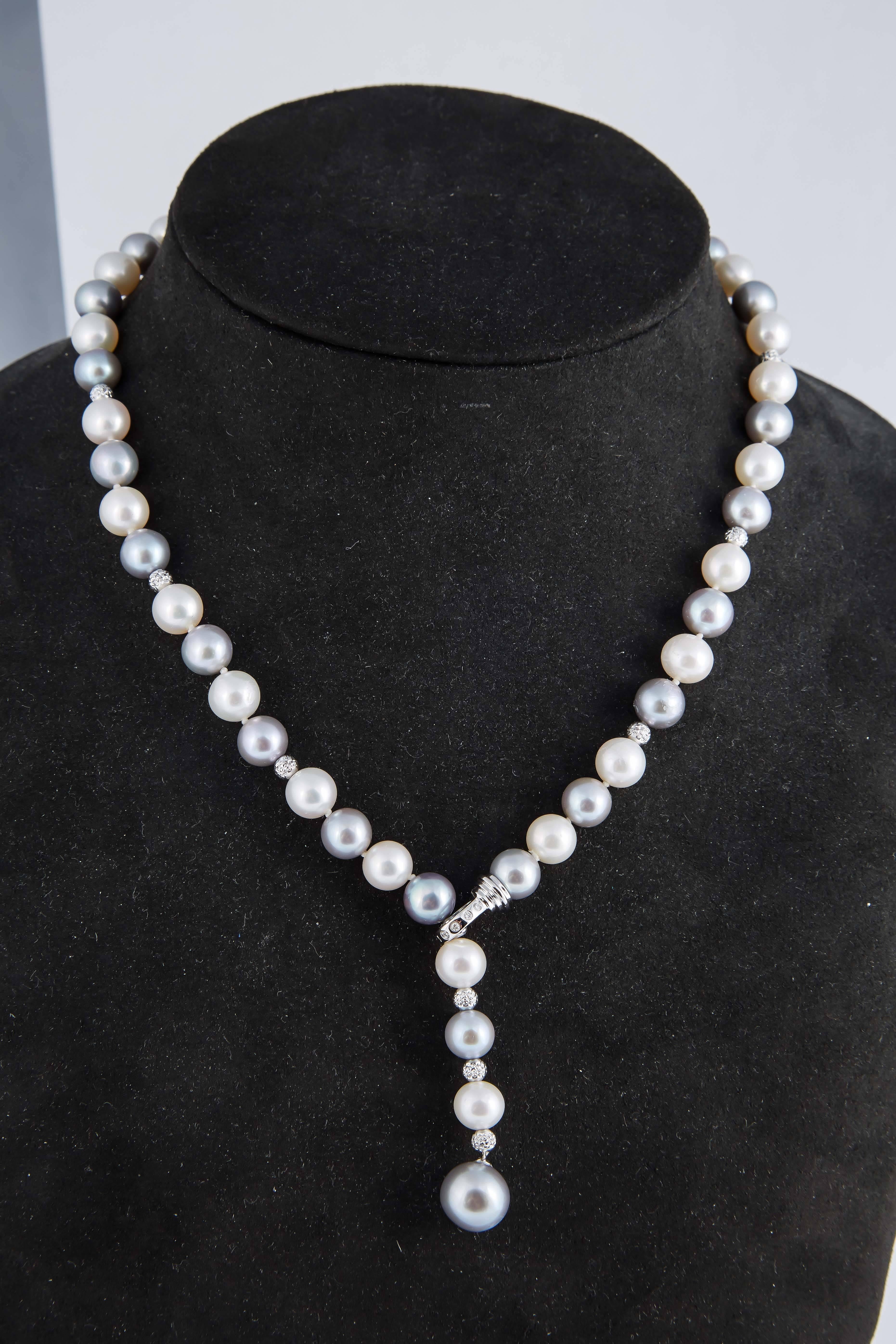 Fresh Water Pearls in Black & White 
Necklace: 8.0-11.0 mm pearls-18K -0.07 cts.
Bracelet: 8.0 mm Fresh Water Pearls
Earrings: Fresh Water
Gold Beads in 18K cut to sparkle to look like Diamonds.