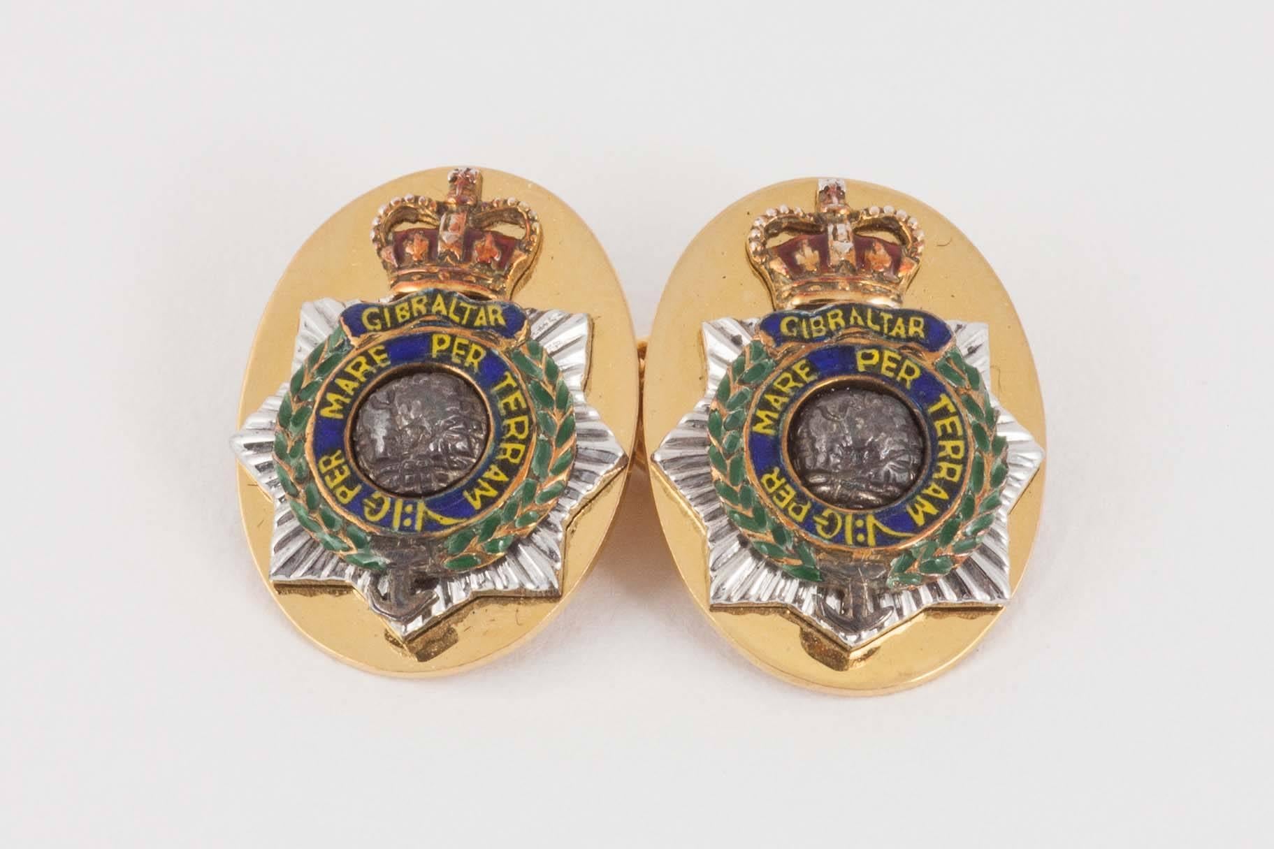 A good quality pair of 9ct yellow gold cufflinks with applied badge of The Royal Marines in white gold and enamel,Gibraltar per mare per terram [by sea by land] . hallmarked for Birmingham 1975 with makers initials JWB.