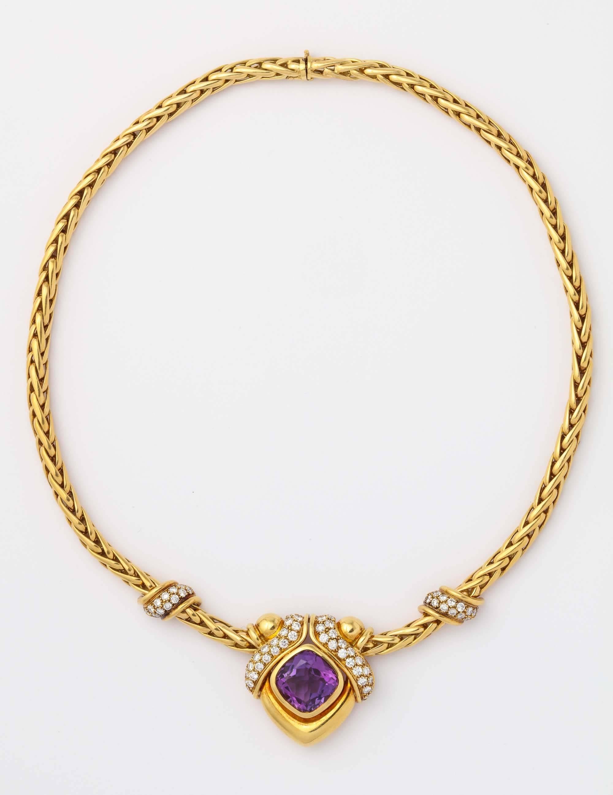 18k handmade rope necklace centering a cushion shaped amethyst approximately 8 carats surrounded by full cut diamonds weighing 1.75 carat