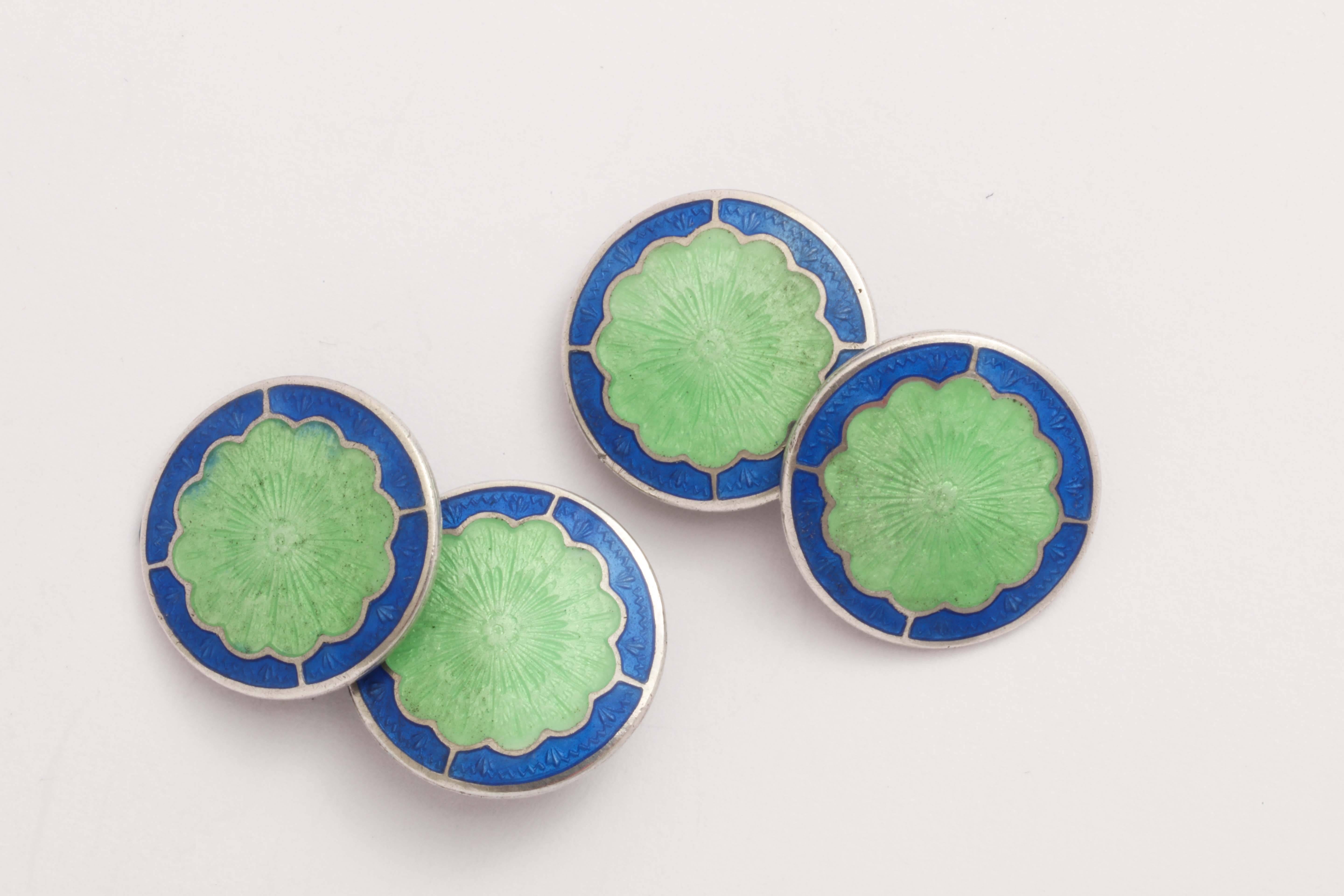 Circular with scalloped green center surrounded by blue border.
Impressed STERLING/ B back to back with an R.