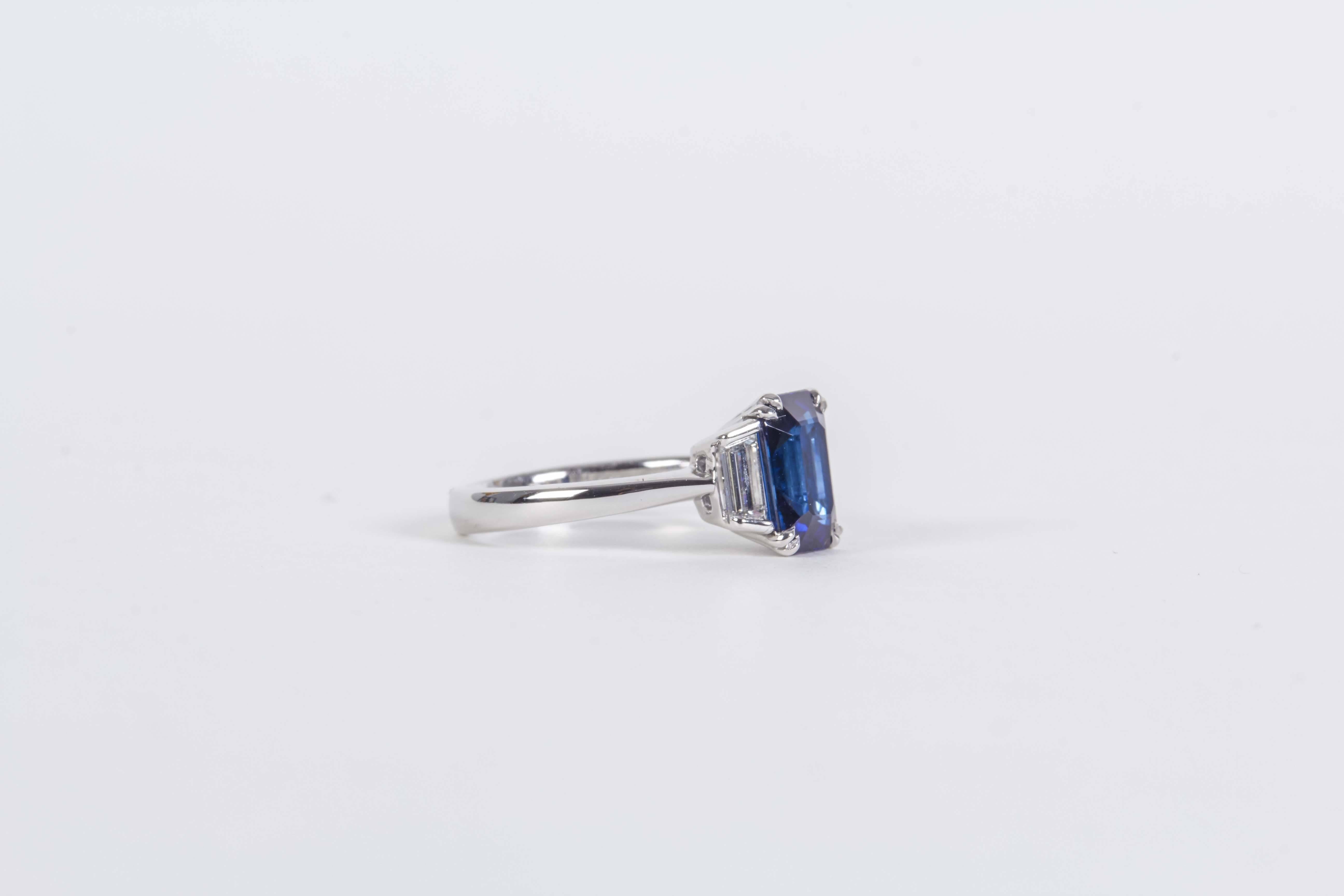 

An elegant sapphire and diamond ring.

2.57 carat Emerald Cut GIA Certified sapphire set with .55 carats of step cut trapezoid diamonds. 

Set in platinum.

A beautiful ring that can be worn daily. 