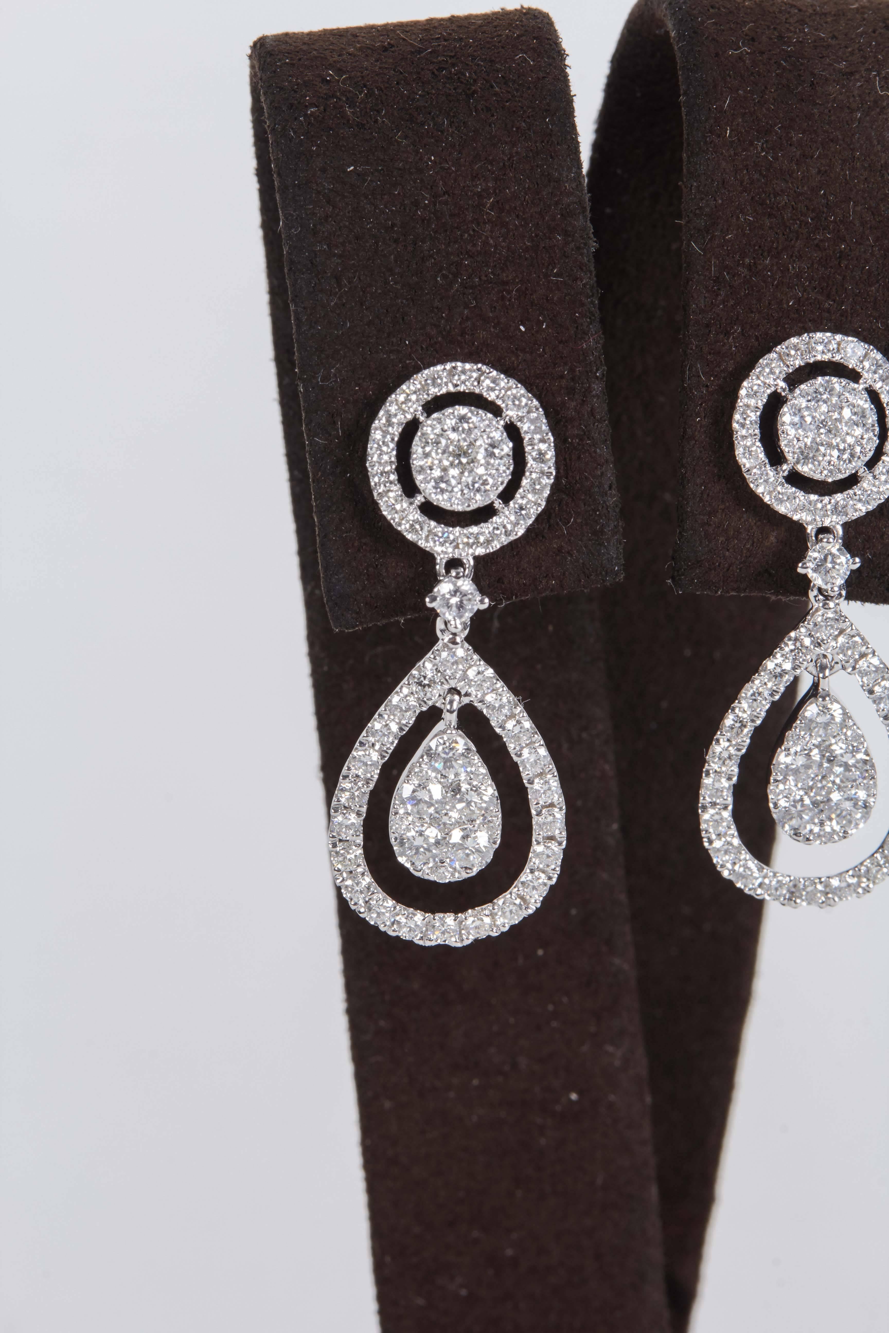 

A must have earring!!

A timeless design, 1.63 carats of round brilliant cut diamonds set in 18k white gold. The diamonds are set in an illusion design to give the top and bottom stones the look of one round and one pear shape diamond. 

About an