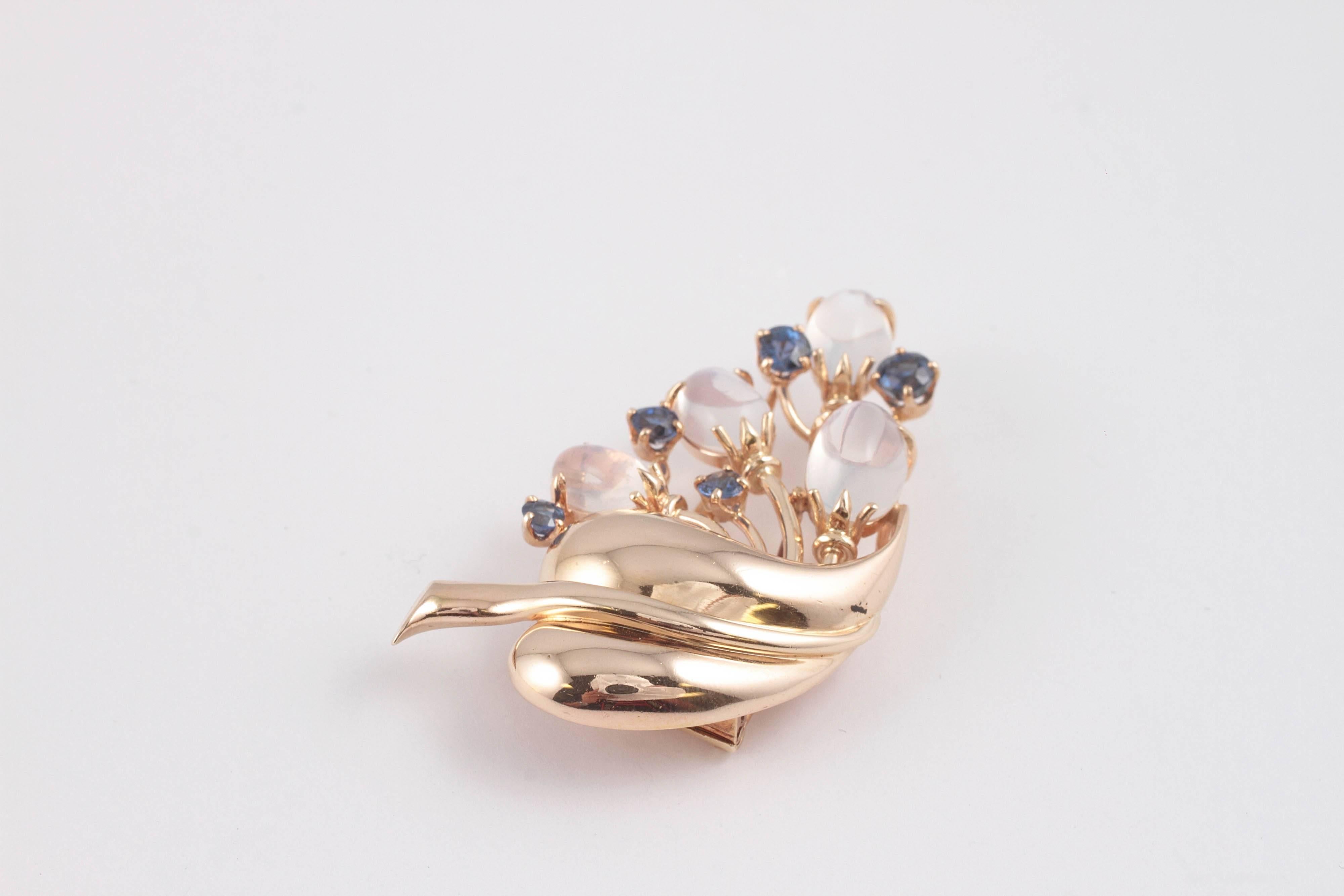 The combination of moonstone and sapphires is striking - complimented by the warm yellow gold!