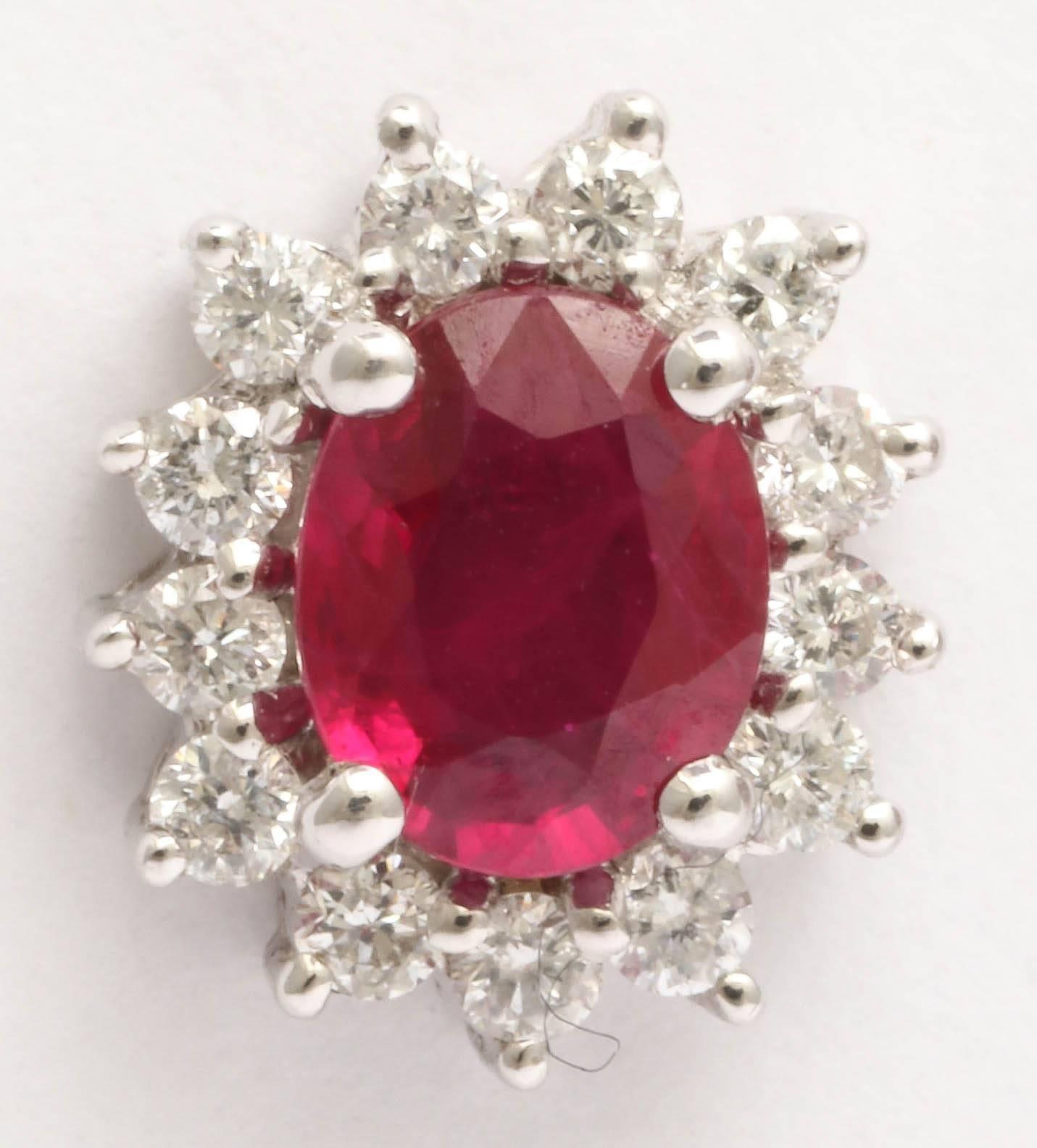 These earrings are the same size as pendant J6961611232176003fs and are a set of 3 matching pieces.  Pendant ,earrings and ring is J6961611232175883fs
Beautiful  bright red ruby weight is 1.16 total and diamond weight is .52cts. Stunning for any