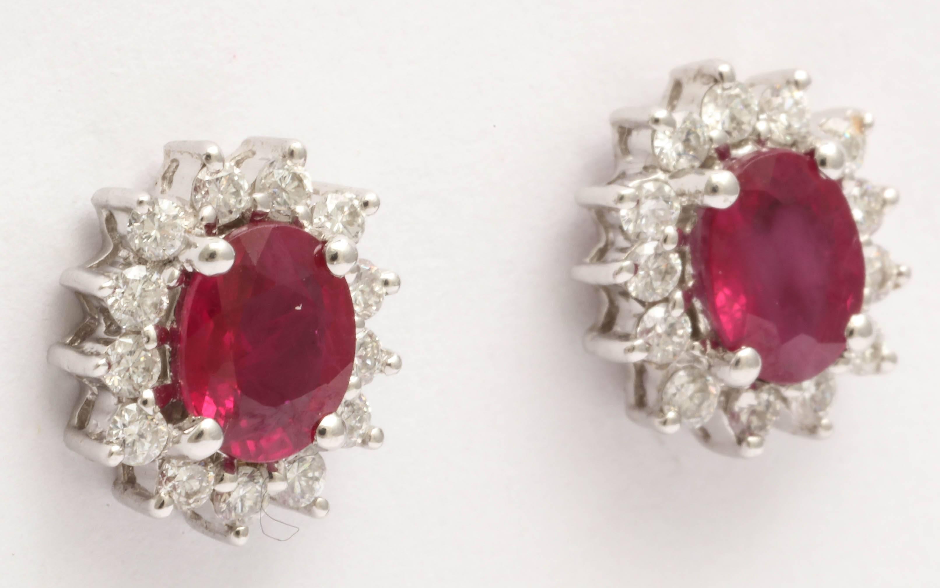 Contemporary Charming Ruby and Diamond stud Earrings For Sale