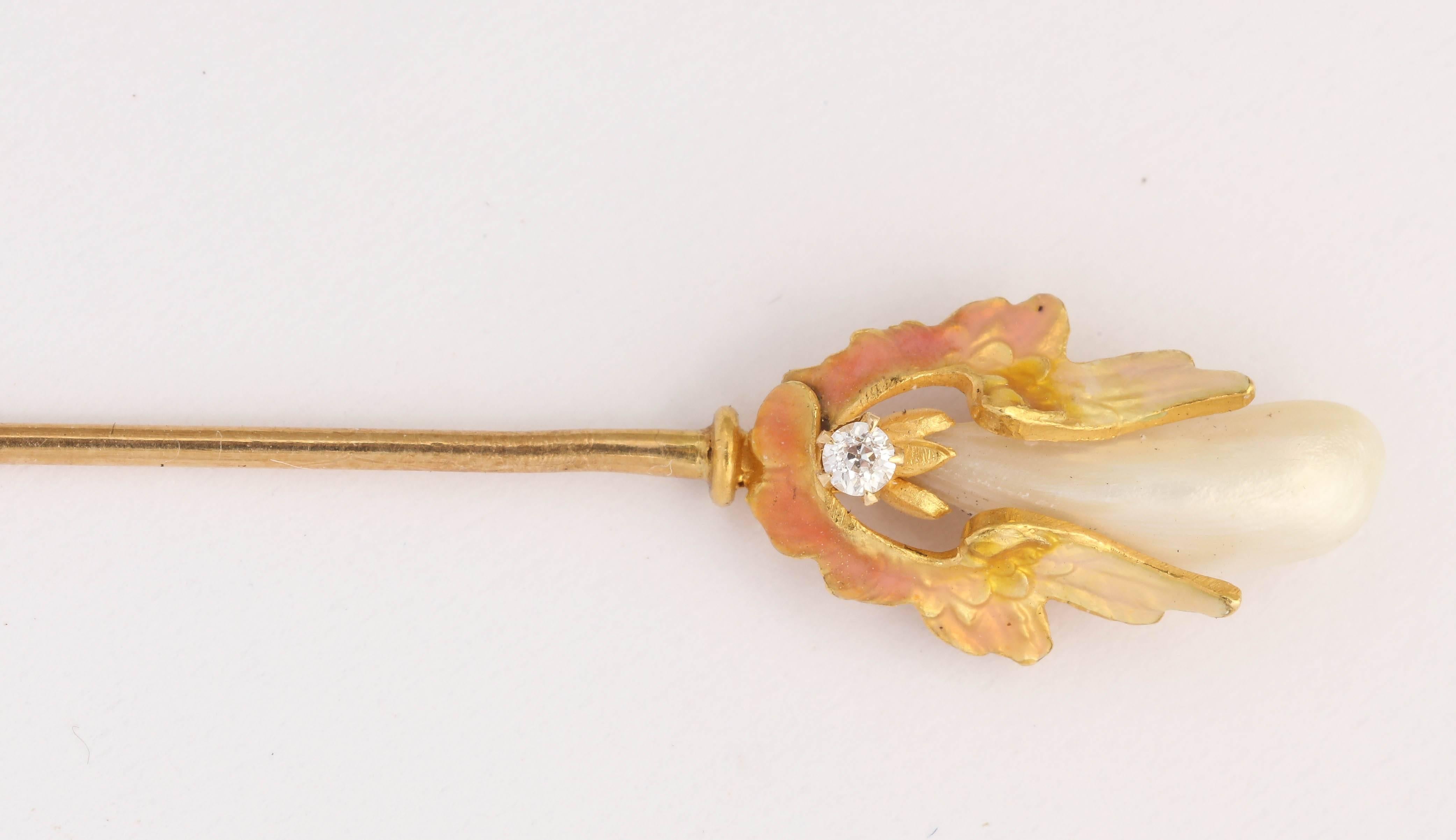This hundred year old stick pin must have seen some great parties in it's day. There are stamps on it attributed to Krementz. The leaves are a beautiful peach color enamel, with a bezel set diamond and a Mississippi river pearls.