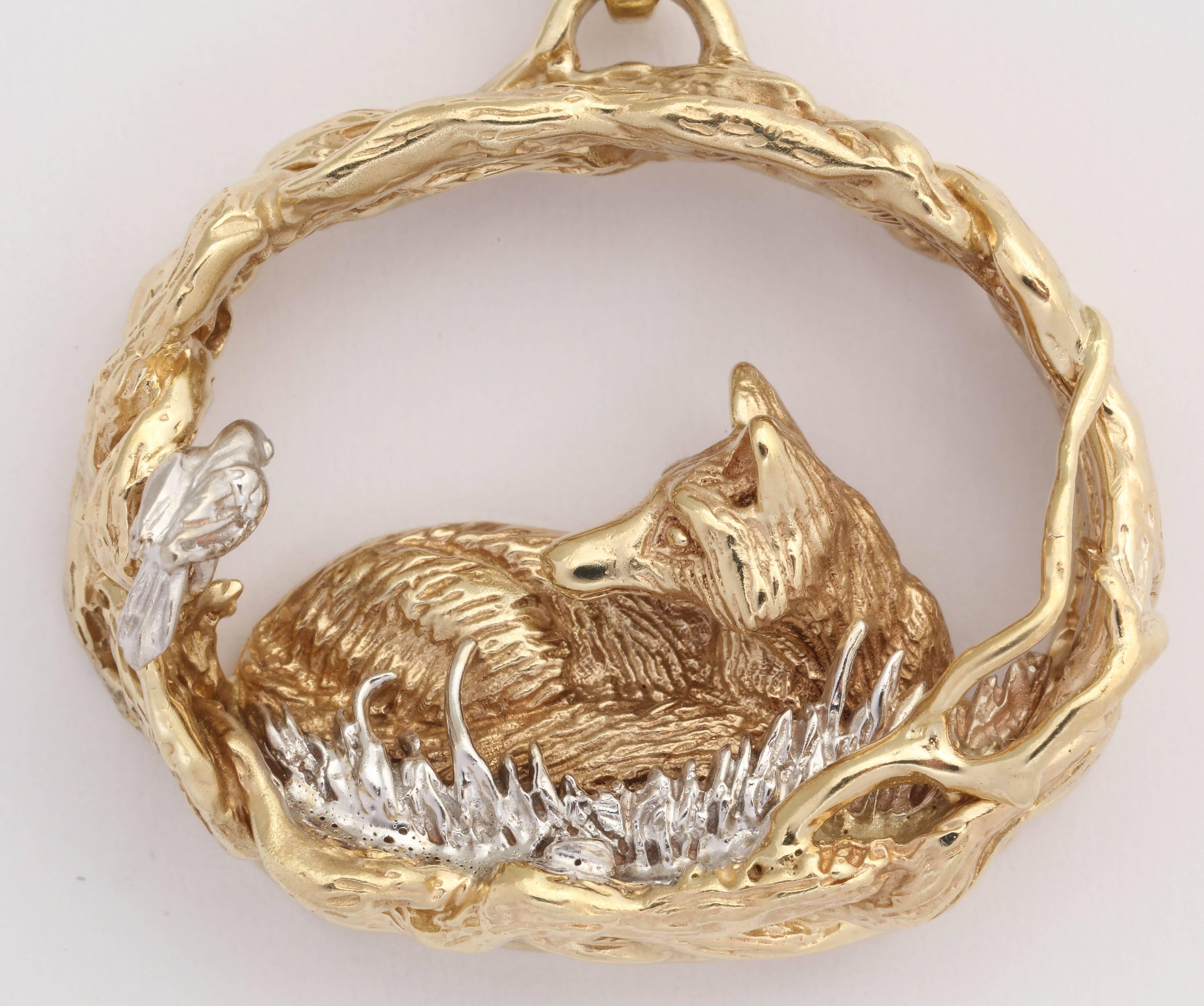 The beautifully carved fox is curled up on a bed of white gold grass with a bird friend stopping by to say Hello. The fox is surrounded by intertwined gold branches.  This is 2/100 limited edition made by Darren K. Moore in Phoenix AZ.