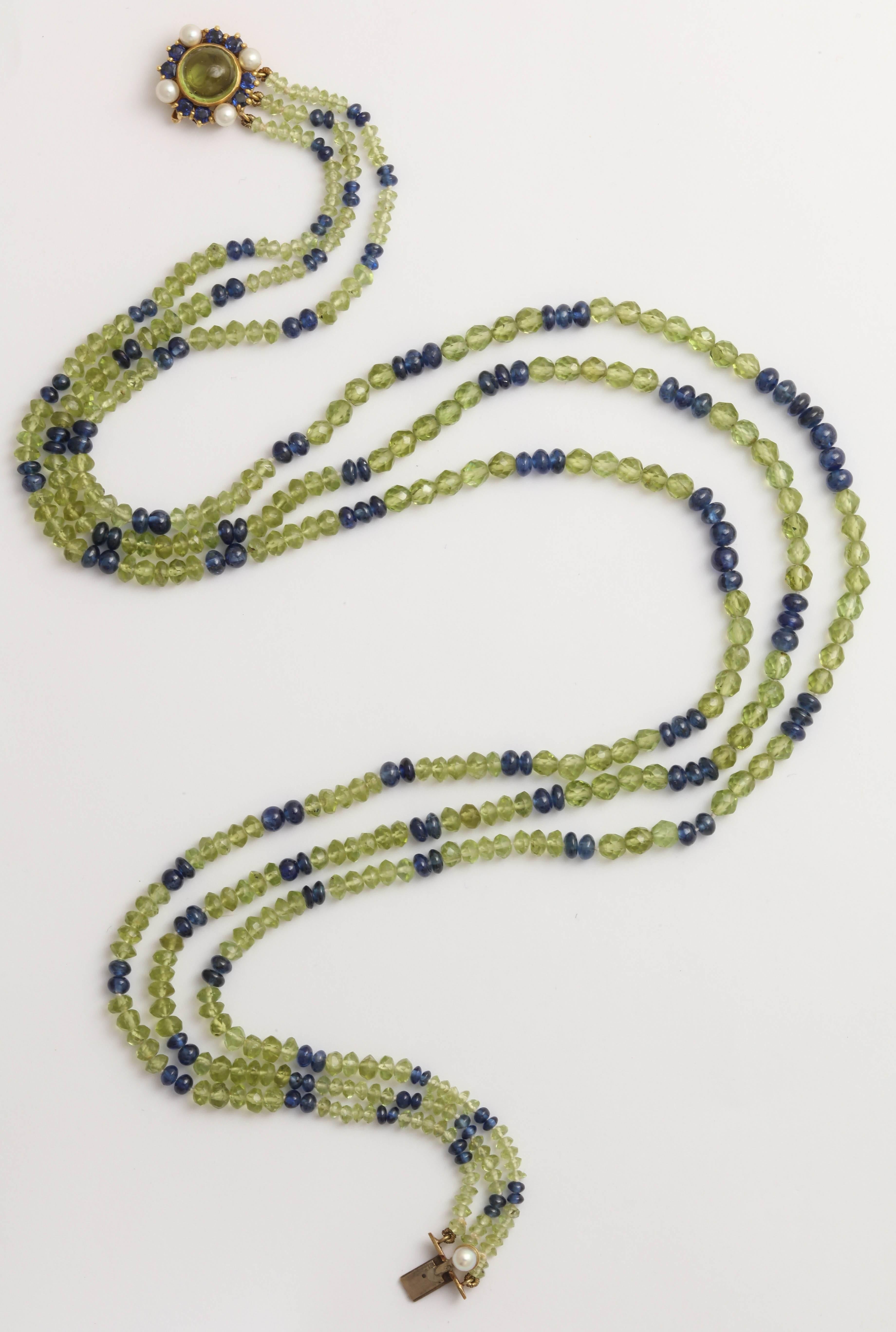 This wonderful color combination is truly stunning. The peridot beads are faceted and the excellent quality sapphire beads are round cut. They graduate in size from the center 5mm beads to the end beads by the clasp. 2-3 mm. The beautiful clasp has