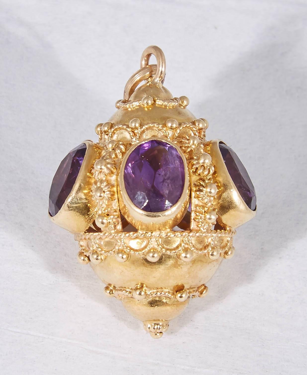 One 18kt Gold Crown Charm/pendant Designed With [5] Faceted Cut Amethyst Stones And Exhibiting Beautiful Textured Gold Workmanship In The Shape Of A Floral Pattern And Trim Design. Made In The 1950's In America.