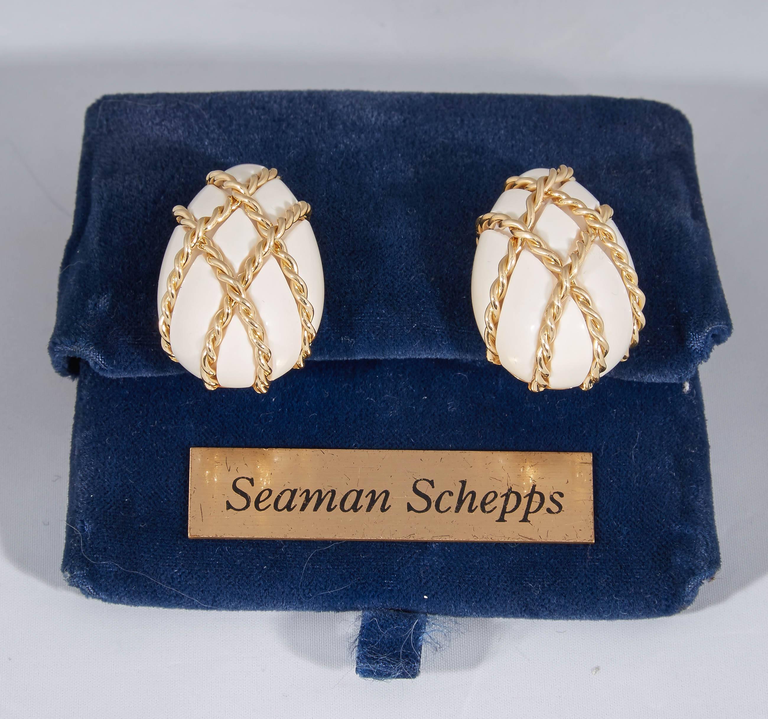 18kt Yellow Gold White Coral In The Cage Earclips Designed With Two Large White Coral Stones Measuring 27mm each stone. Created With A Beautiful Rope Design Effect / Cage Workmanship Upholding Each Coral Stone. Signed Seaman Schepps Serial # 1134