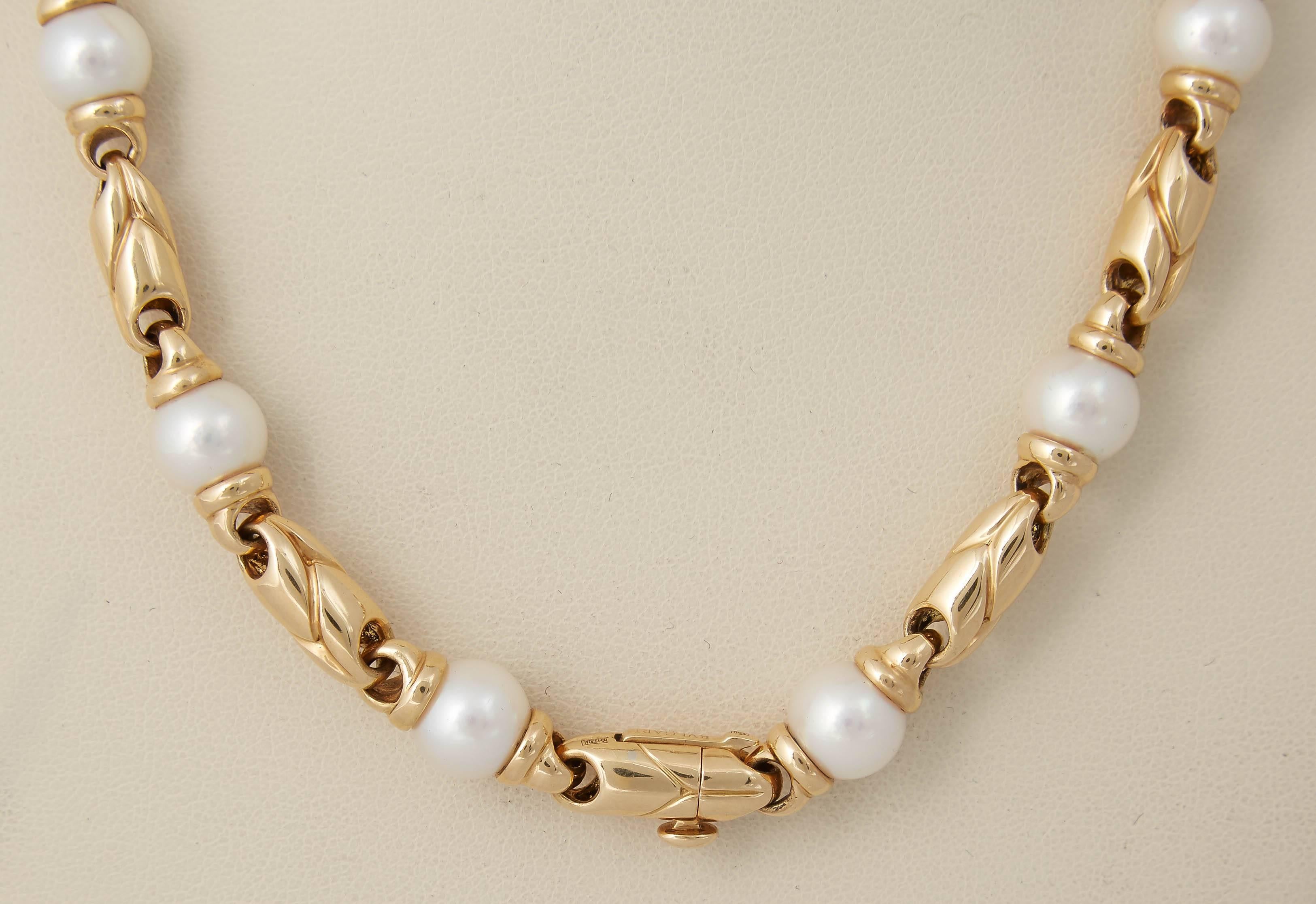 18kt Yellow Gold 22 & 1/2 Long Chain Designed By BVLGARI and may be Worn Separately As A Choker Measuring 15 & 1/2 Inches And A Bracelet Measuring Approximately 7 Inches. Designed By BVLGARI With [ 20] Very High Quality 7.5 Mm Beautiful Luster