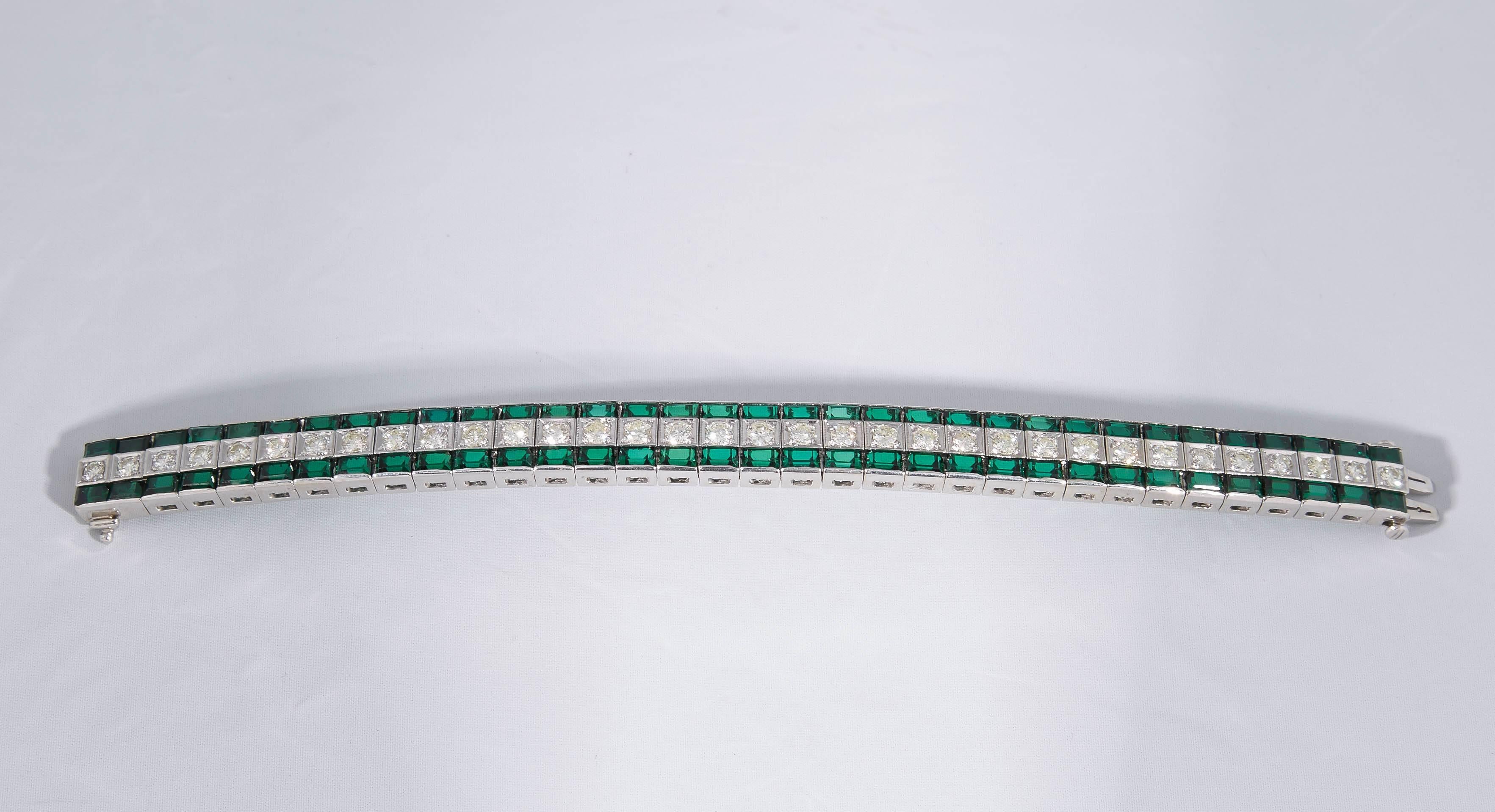 One Ladies Triple Straightline Bracelet Consisting Of Numerous Horizontal Baguette Cut Green Tourmalines Weighing Approximately 10 Carats,Centered By Numerous High quality Full Cut Diamonds Weighing Approximately 4 Carats Total Weight. Triple