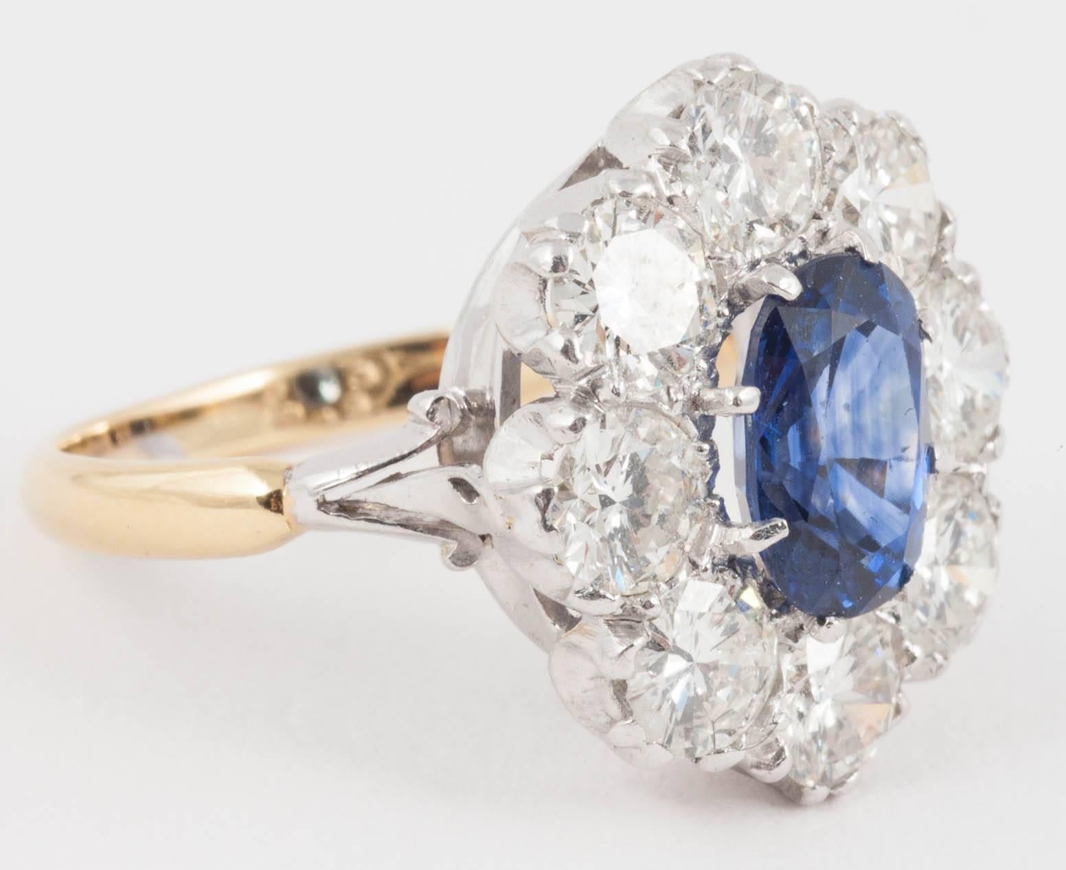 This natural Ceylon Sapphire ring surrounded by Diamonds set in 18ct White and yellow 18ct Gold from the 1940's

Ring size L 
