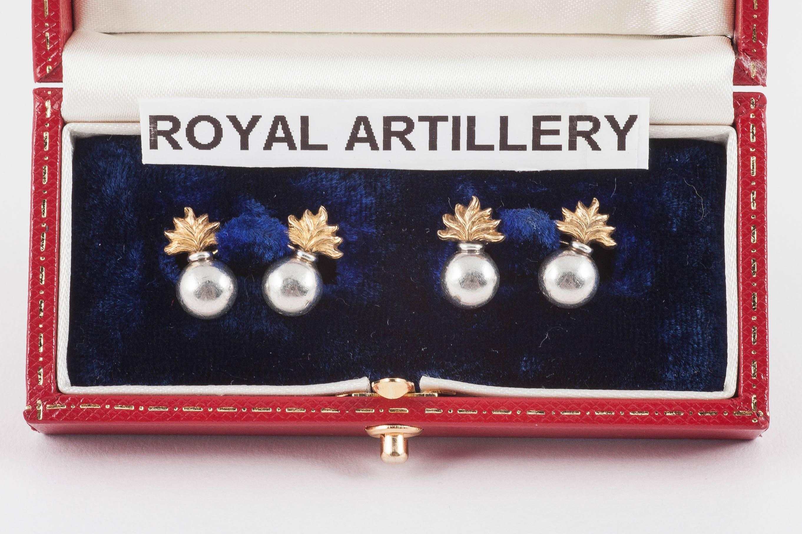 A heavy pair of 18 carat yellow gold and platinum double sided cufflinks of the emblem of the Royal Artillery. Chain link connections. The mixing of platinum with yellow gold is typical of this period, previously silver would have been used in place