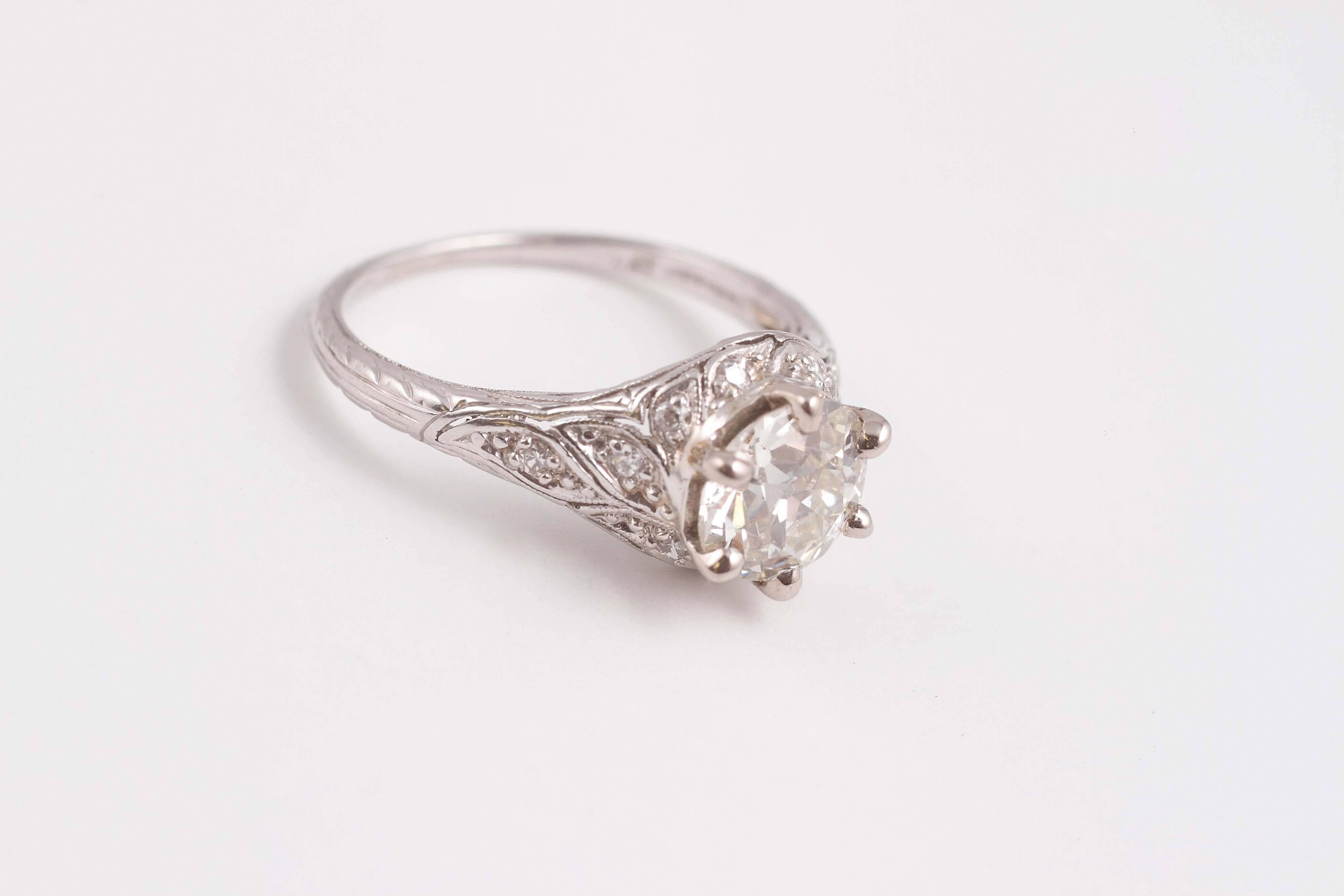 Composed of platinum, centered with one 1.35 ct old European-cut diamond, SI in clarity, G - H in color.  Size 5 3/4.