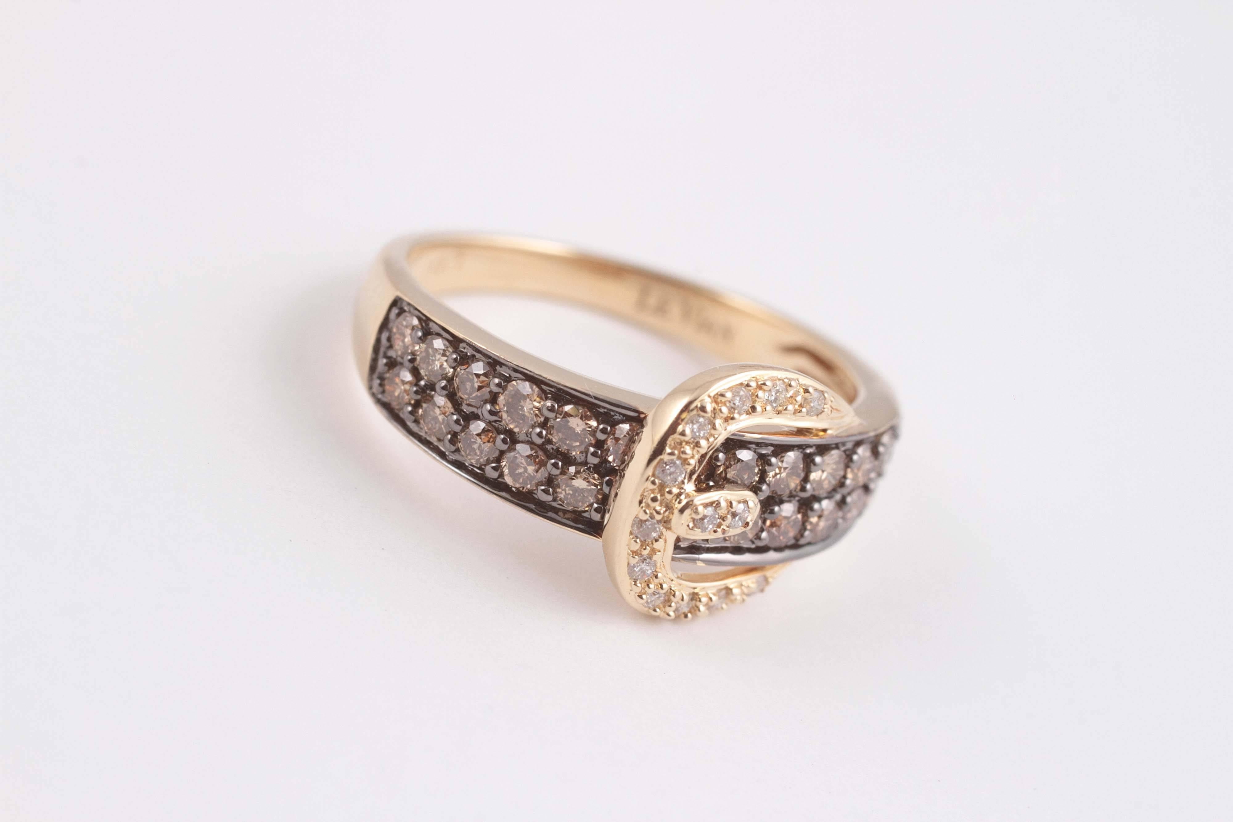 In 14 karat yellow gold, with brown diamonds, size 7 1/4.
