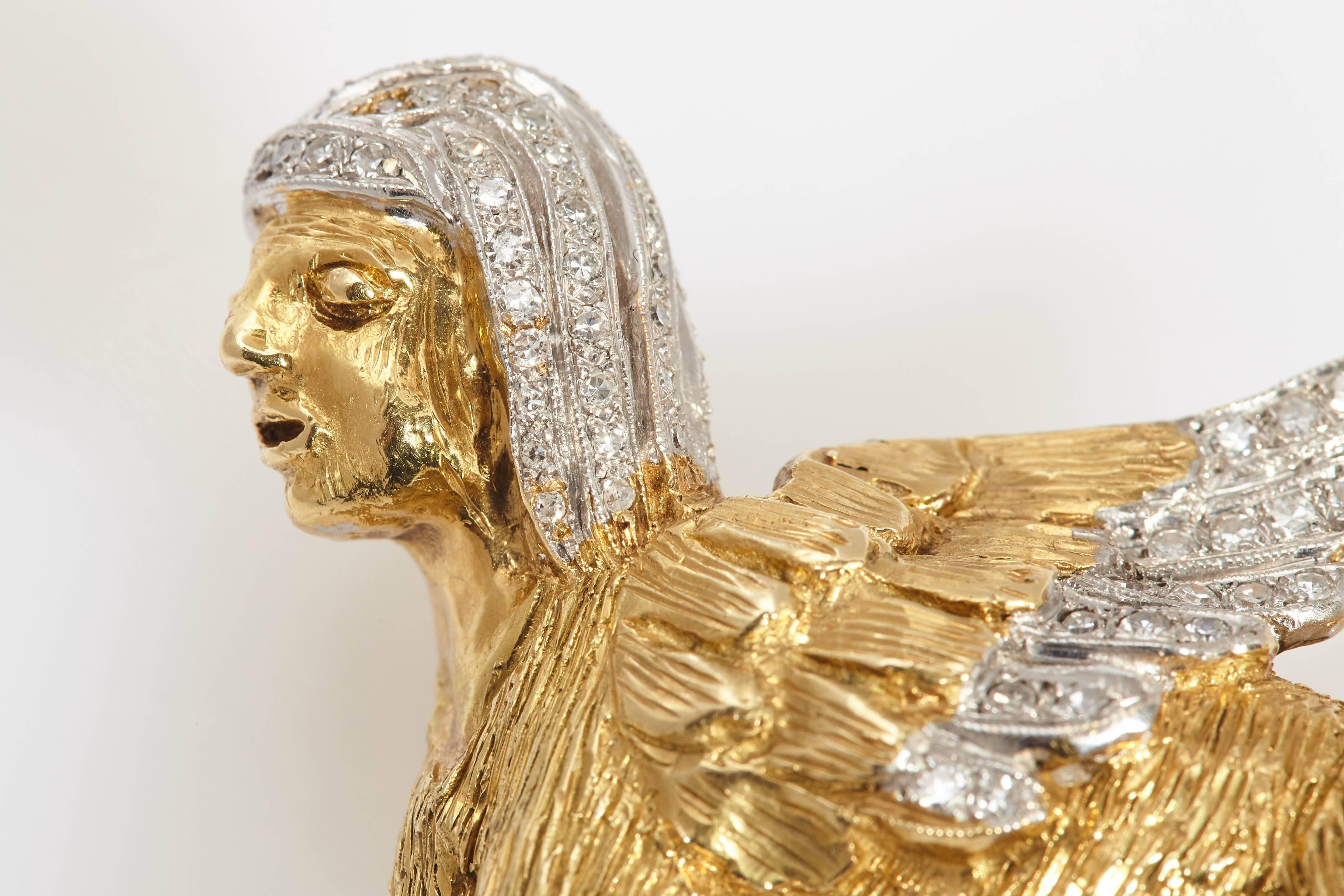 A peculiar 18kt yellow gold and diamond Sphinx brooch. Made in Italy, circa 1970 