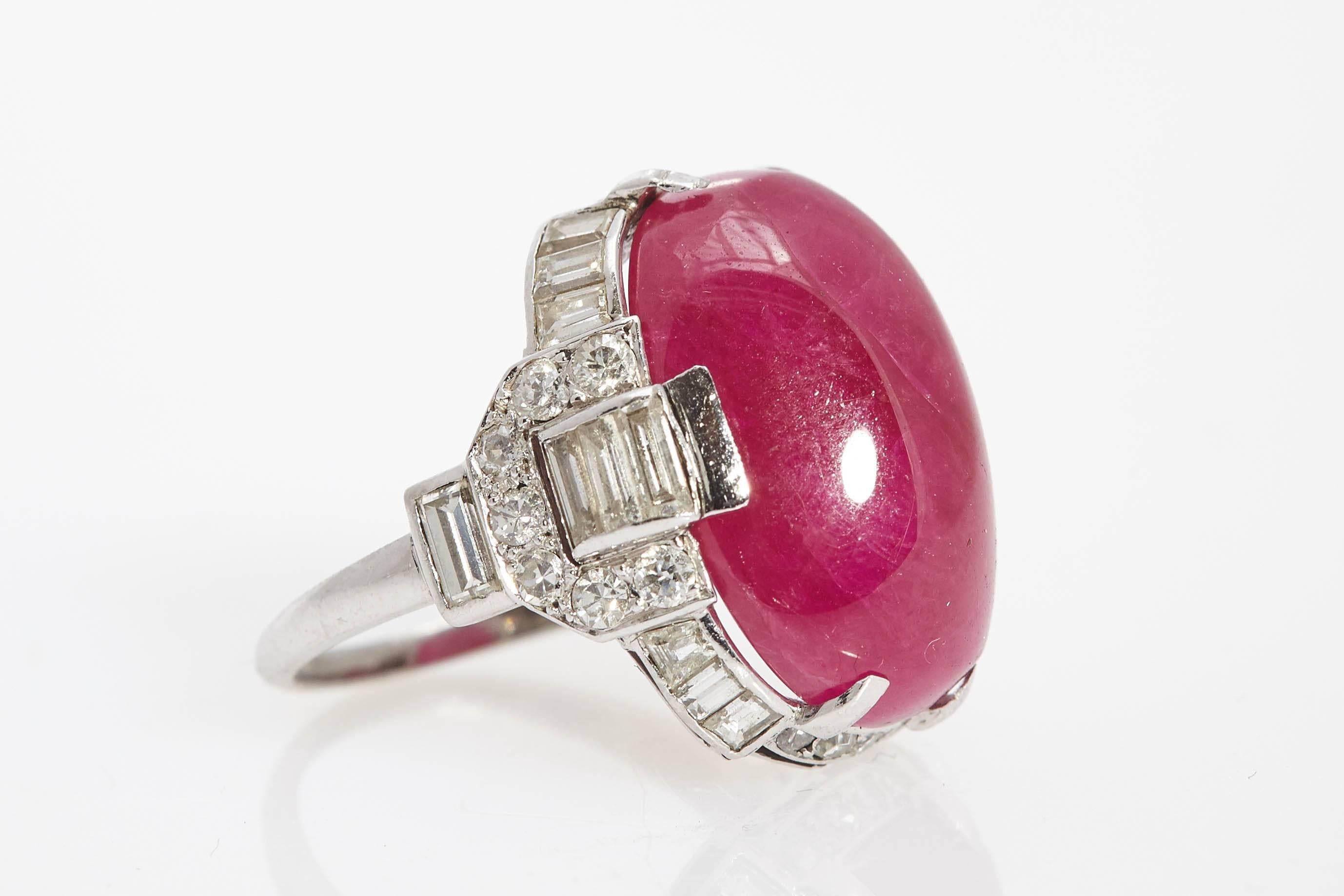 An Art Deco ring showcasing a 25.03 carat Burmese ruby, enhanced by a platinum and diamond mounting. Circa 1925 