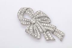 1930s Diamond Platinum Naturalistic Bow Pin