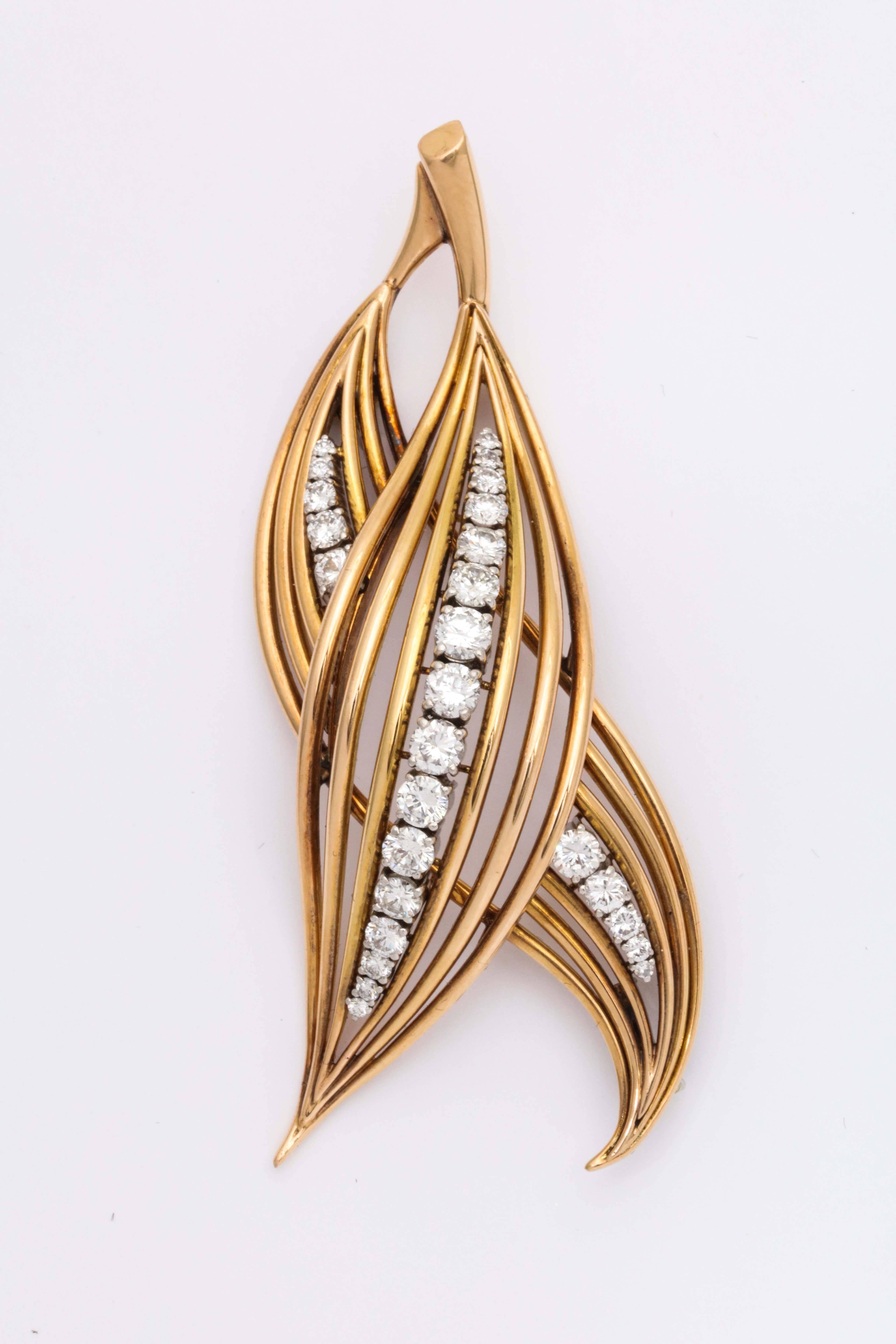 Beautiful Handmade Double Leaf Pin.  A pair of Pierced Leaves  set with Fine White Diamonds set in Platinum. down the middle of each Leaf.   Ca 1950.  Perfect for late lunch or cocktails.  Over 2.5cts of graduated full cut Diamonds