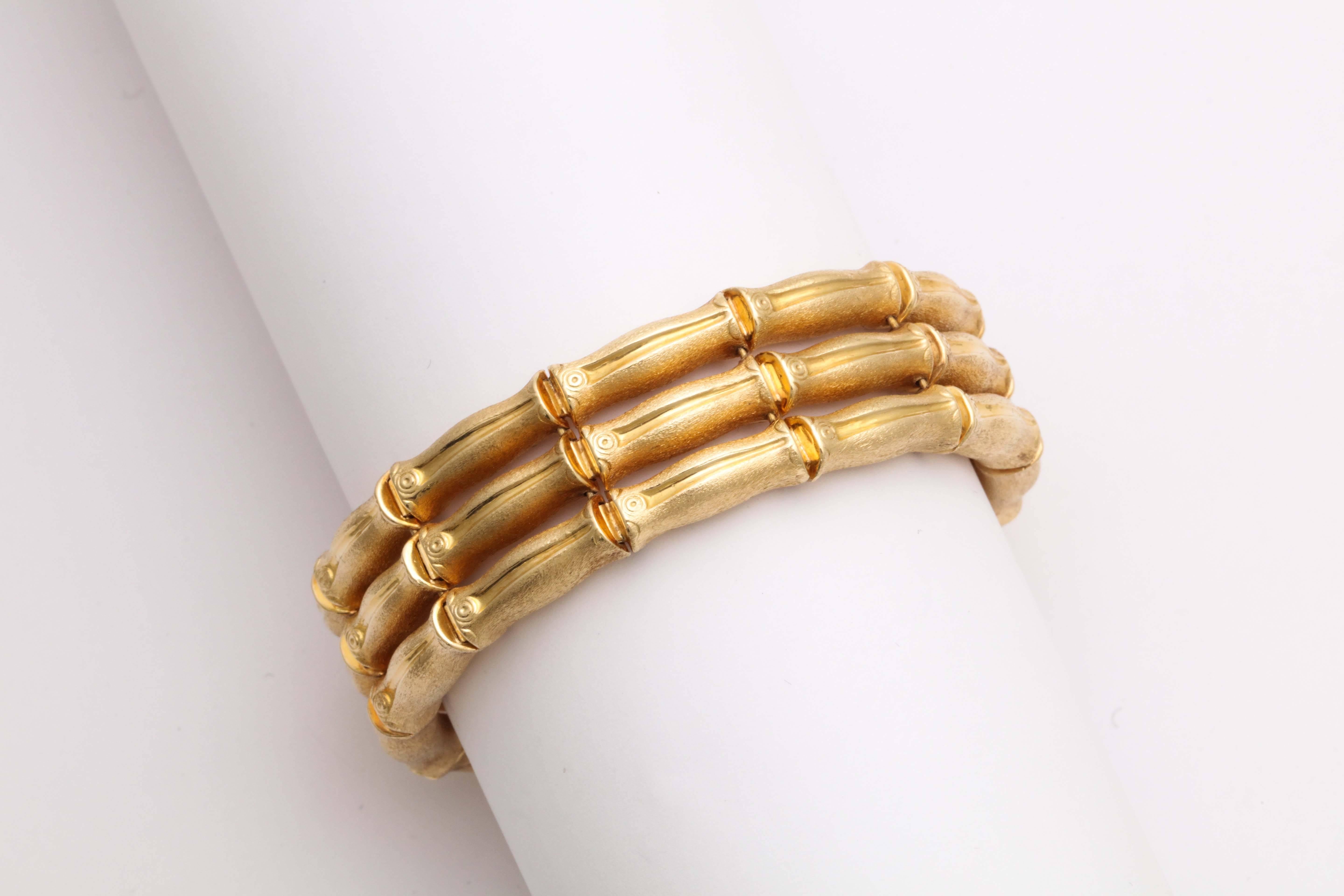 Italian Bamboo Bracelet with brushed finish.  18kt Yellow Gold Bracelet made up of  3 rows of Bamboo segments.  Very chic yet carefree.  Marked 750 in lozenge shaped mark.  Perfect for any occasion and at any time of day.