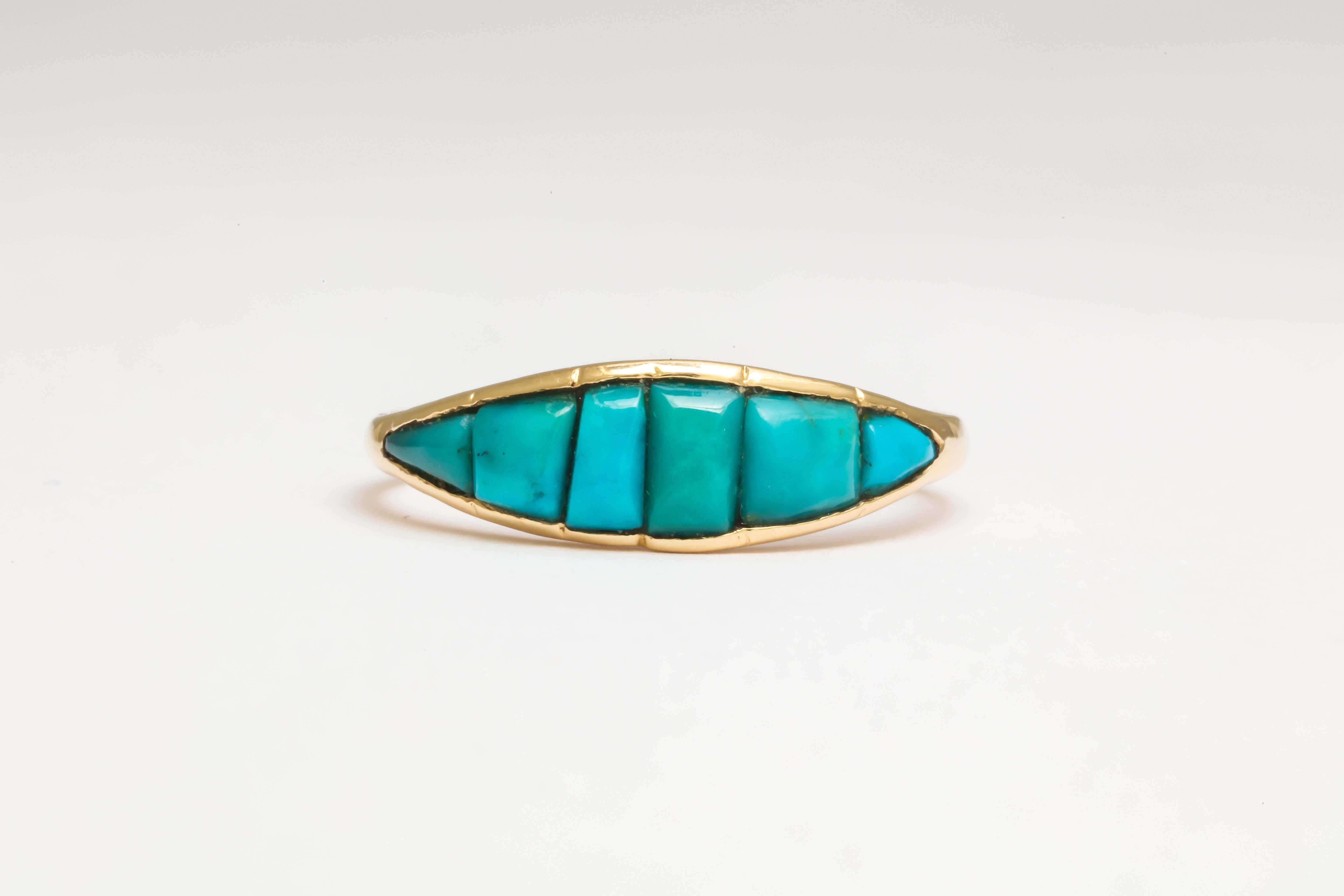 Impeccably made, this ring is set with 6 Persian turquoise that have been cut to fit in the navette shape. It is quite early, of the Georgian period, and has a closed back setting indicative of the period. 