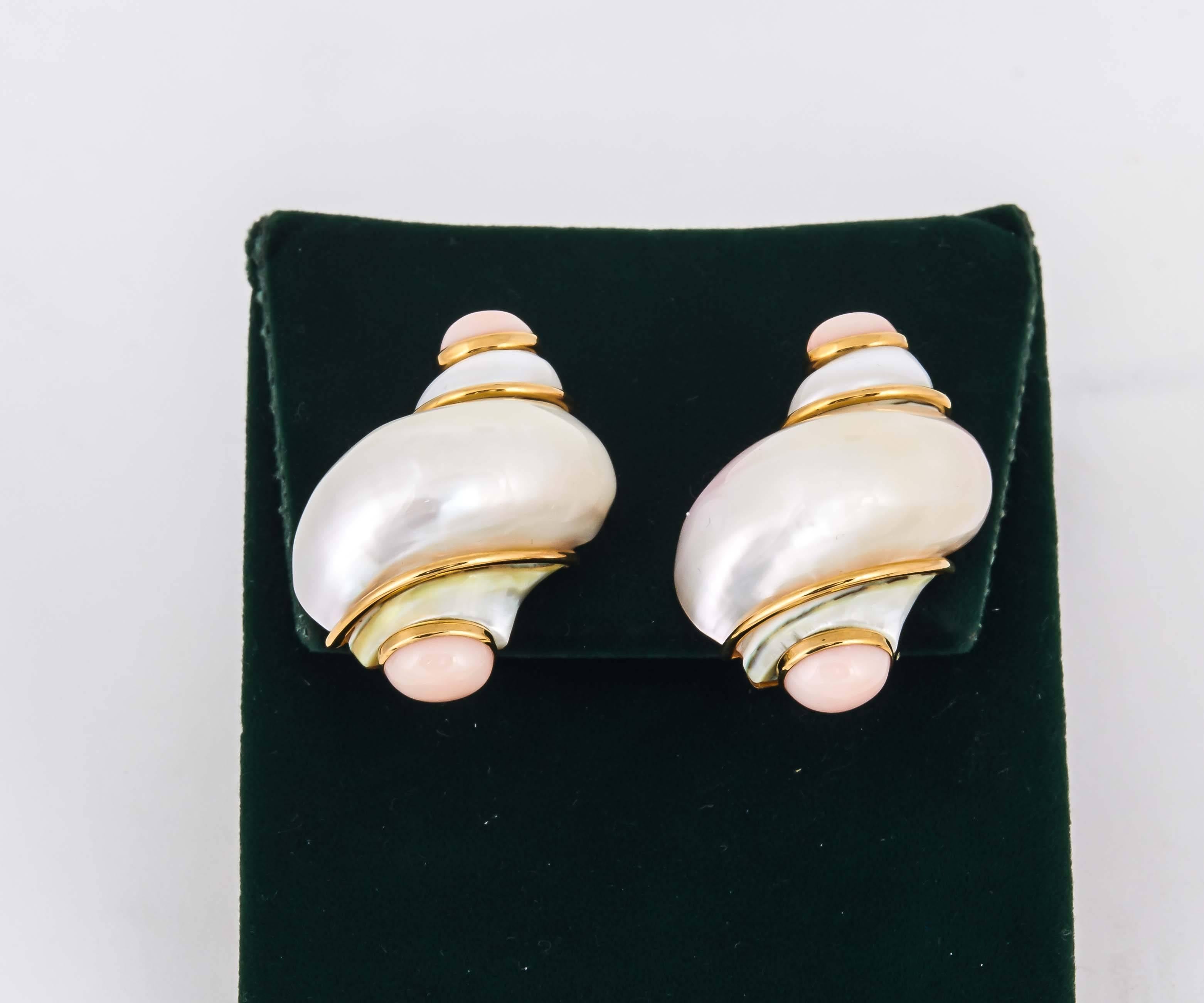 18kt Yellow Gold Shell Design Earclips Composed Of Two Large Pink Irridescent Mother Of Pearl Stones Measuring Approximately 28mm Each. Further Designed With Four Cabochon Cut Angel Skin Coral Embellishments Measuring 3MM Each Stone. Designed In The