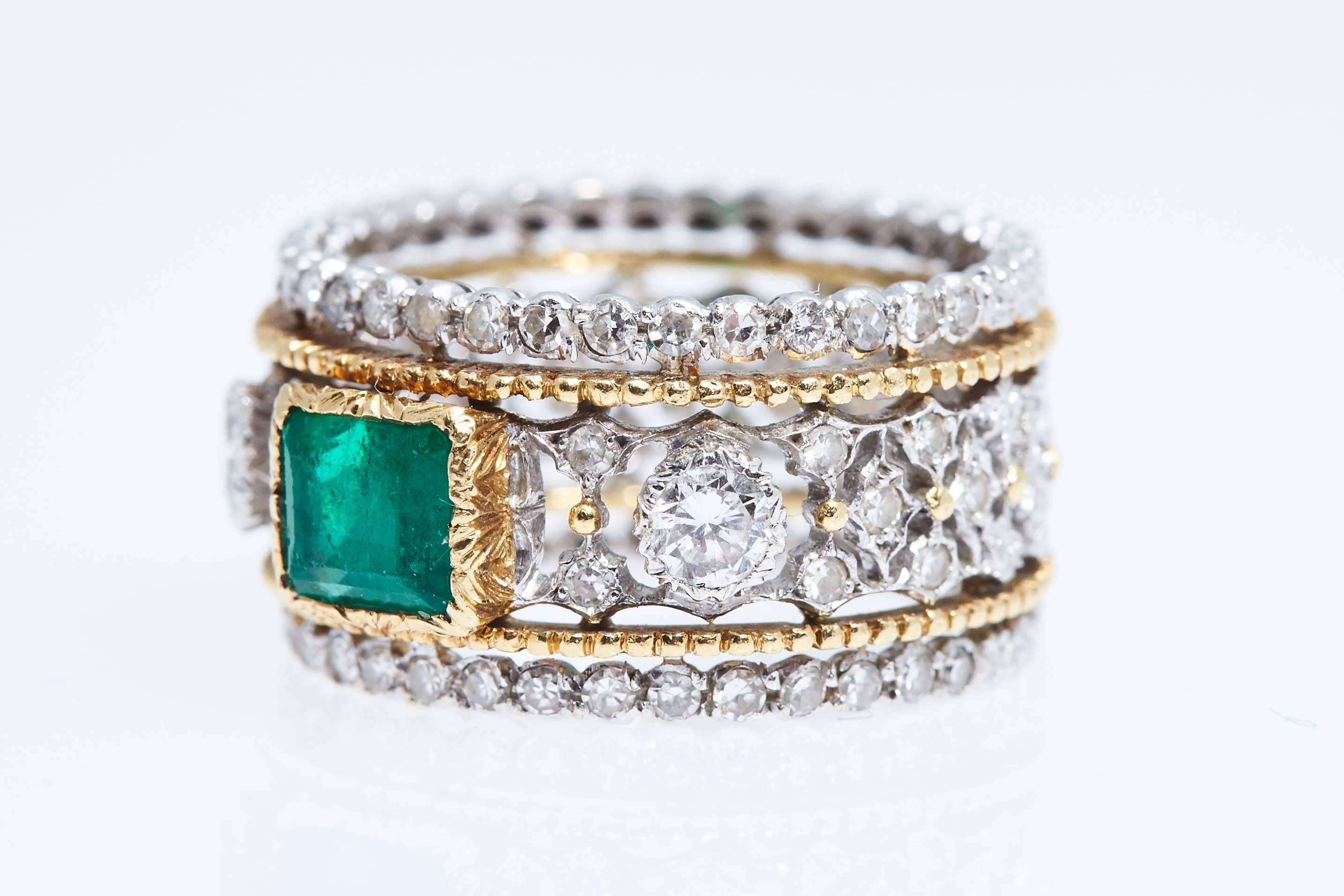 Buccellati emerald and diamond 18 karat gold and silver ring.  The rectangular emerald weighs approximately .70 carat and the diamonds weigh a total of approximately .30 carat. The ring is approximately 11mm. wide and finger size 6 1/4. It is