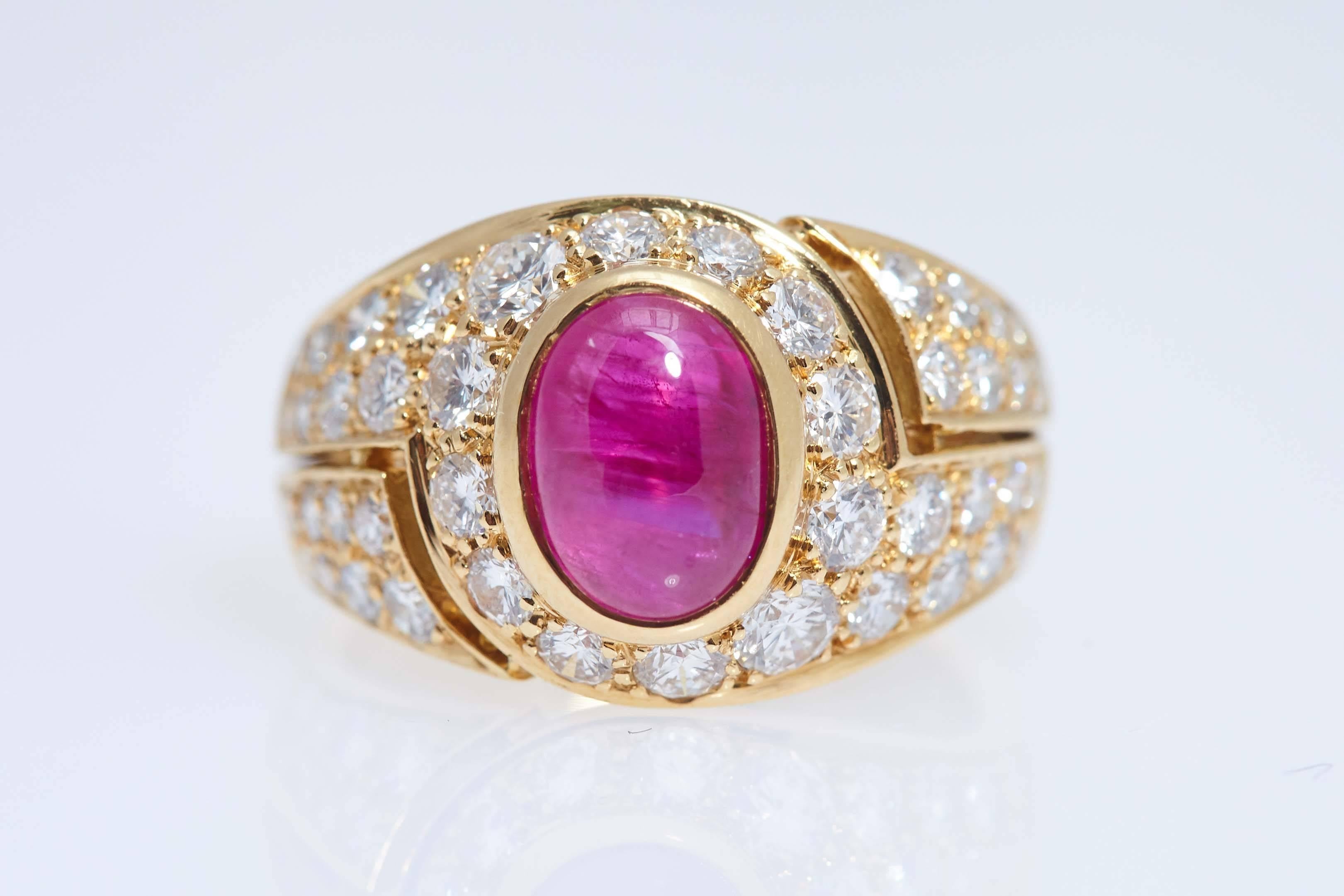 Bulgari Burma Cabochon Ruby, Diamond, 18 karat yellow gold ring. The ruby weighs approximately 2.00 carat and the 42 diamonds have a total weight of approximately .75 carat. The ring is stamped "Roma, BVLGARI, 750" and is size 4 3/4.