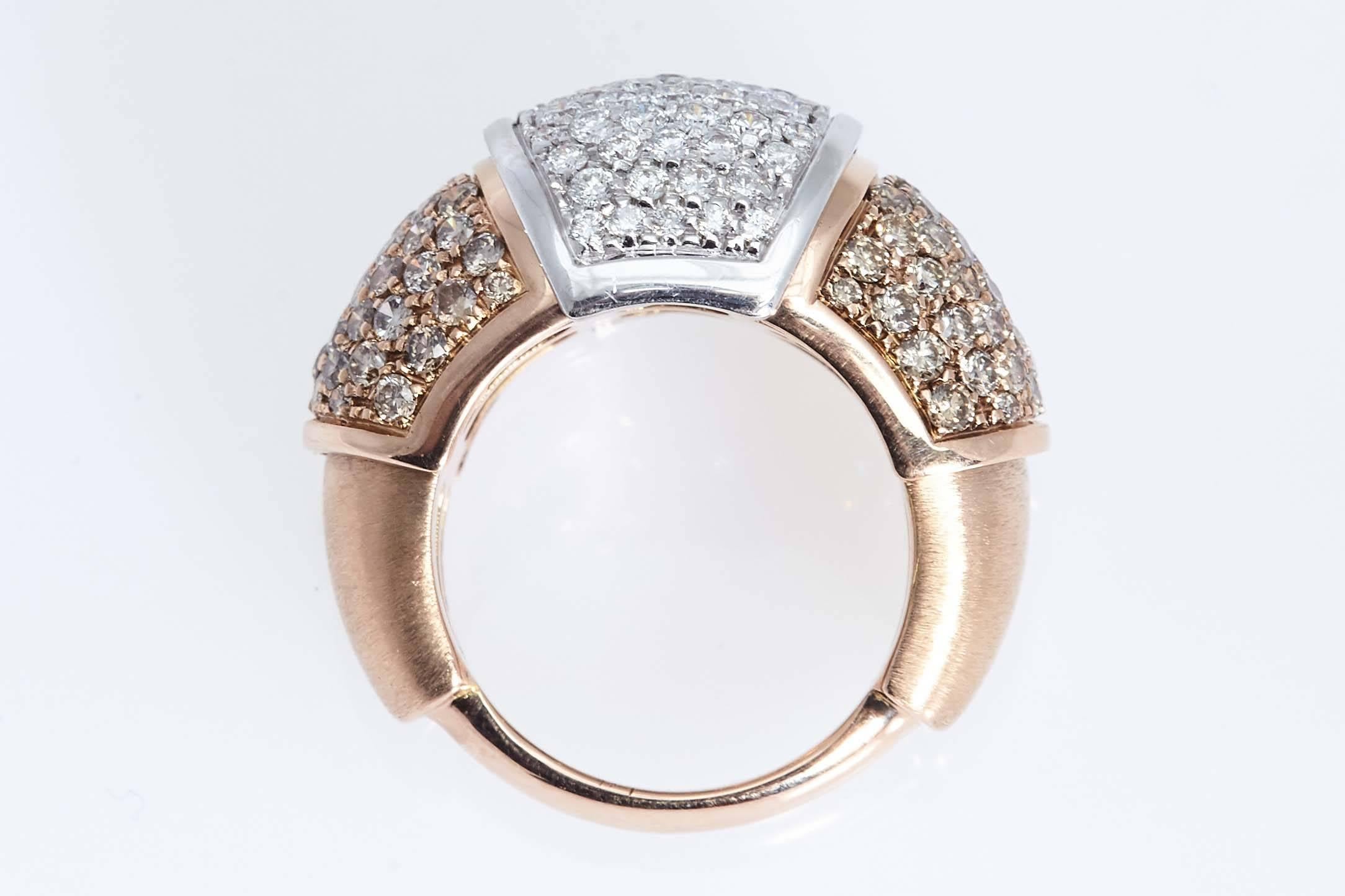 White and brown diamond ring mounted in 18 karat pink and white gold. The ring contains a total of 3.19 carats, made up of  1.18 carats of white diamonds and 2.01 carats of brown diamonds. The ring is size 6 1/2.
