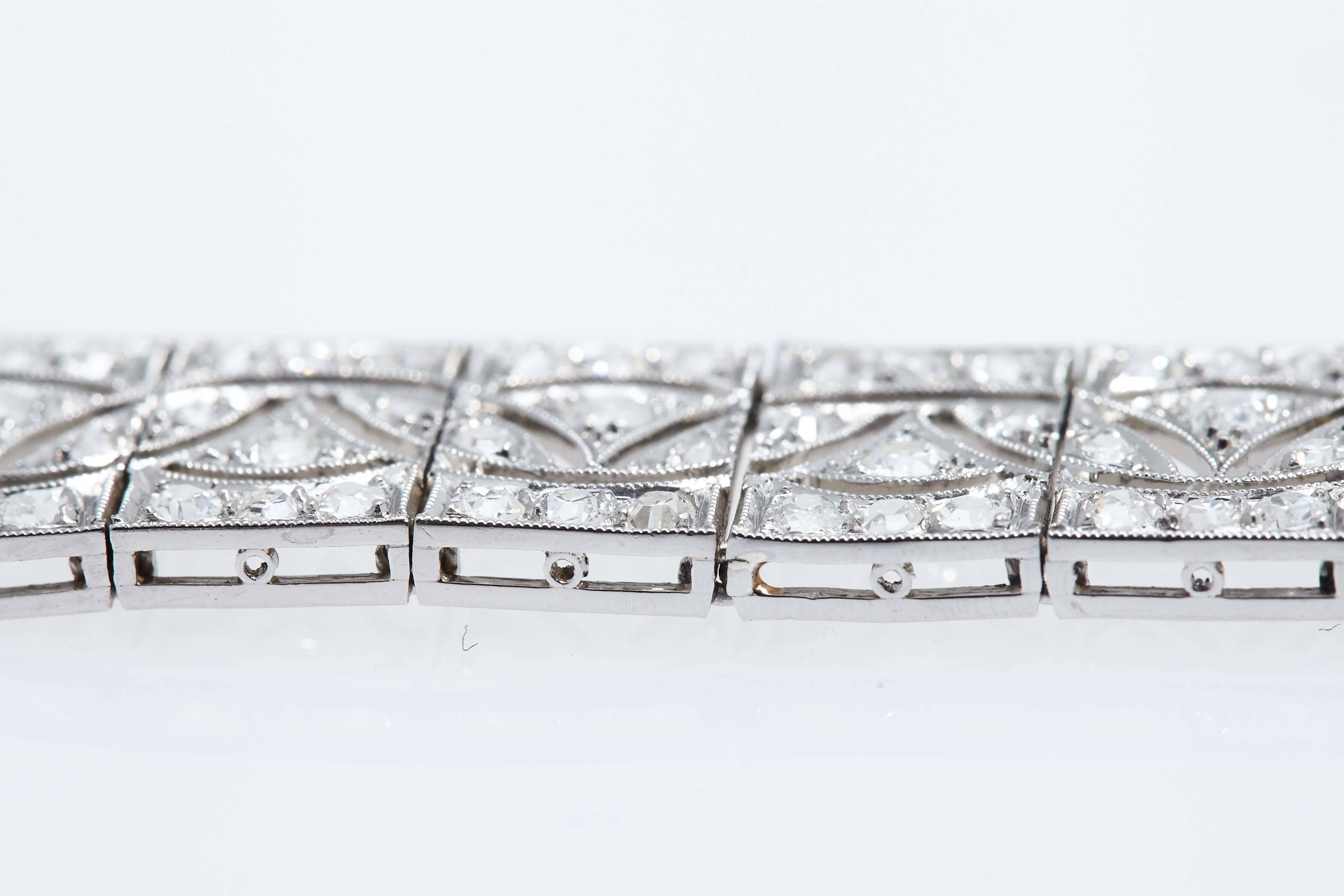 This beautifully crafted Art Deco platinum and diamond bracelet contains approximately 10 carats in diamonds.  The bracelet is 7 3/8 inches long and 1/2 inch wide.  