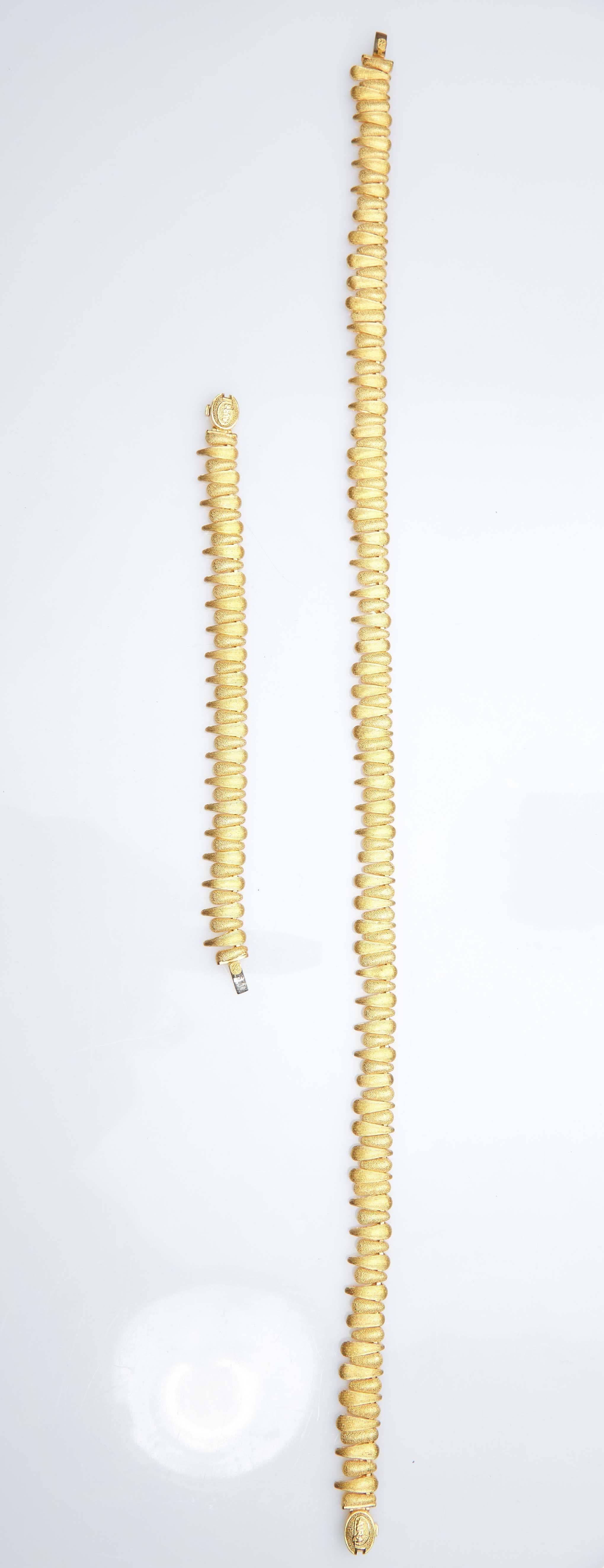 Modern 24 Karat Gold Necklace and Matching Bracelet For Sale