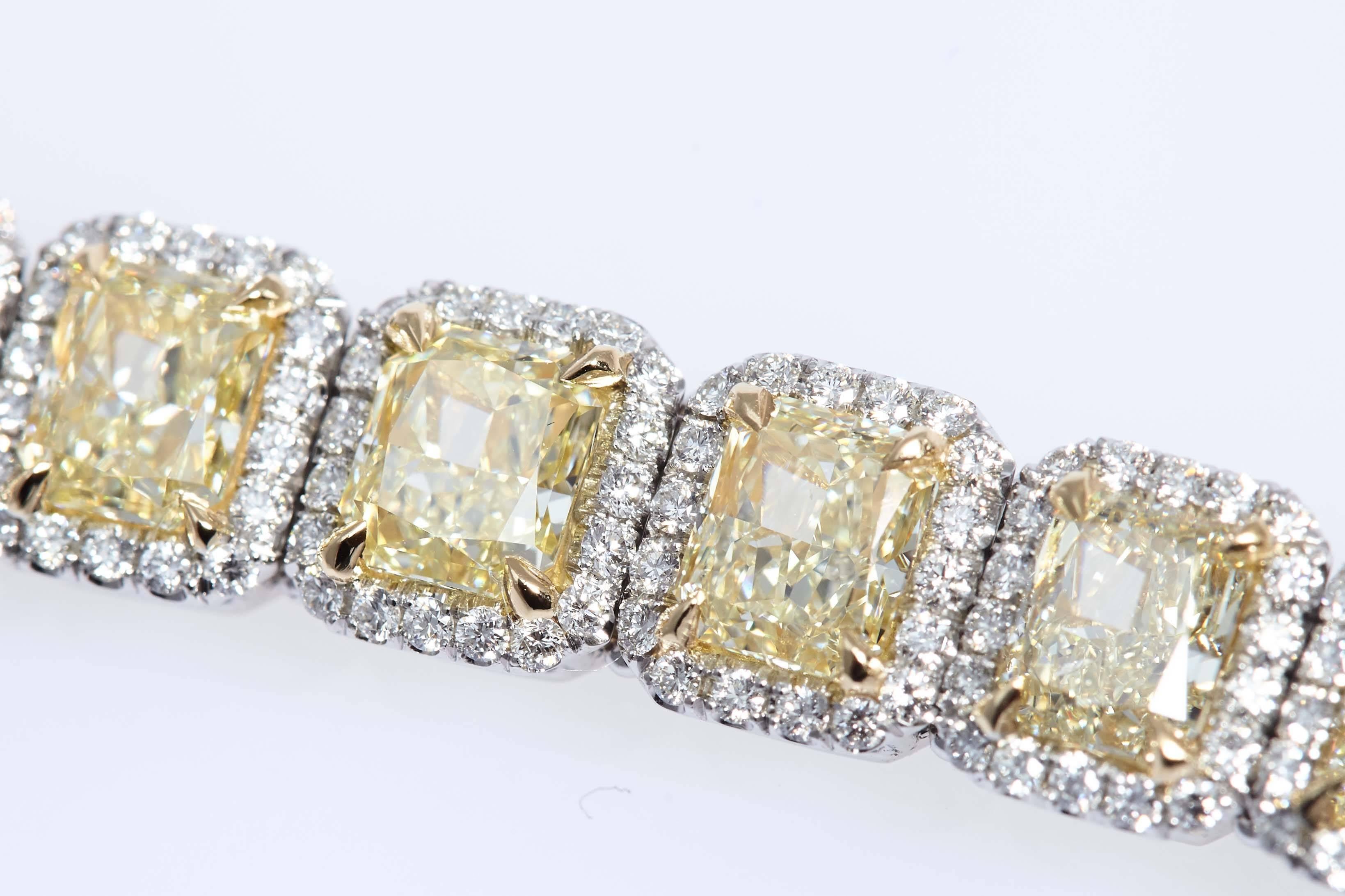 Custom made platinum and 18 karat yellow gold bracelet made up of 21 yellow radiant cut diamonds with a total weight of 24.67 carats and 406 round diamonds with a total weight of 3.50 carats.  The bracelet measures 7 inches in length.