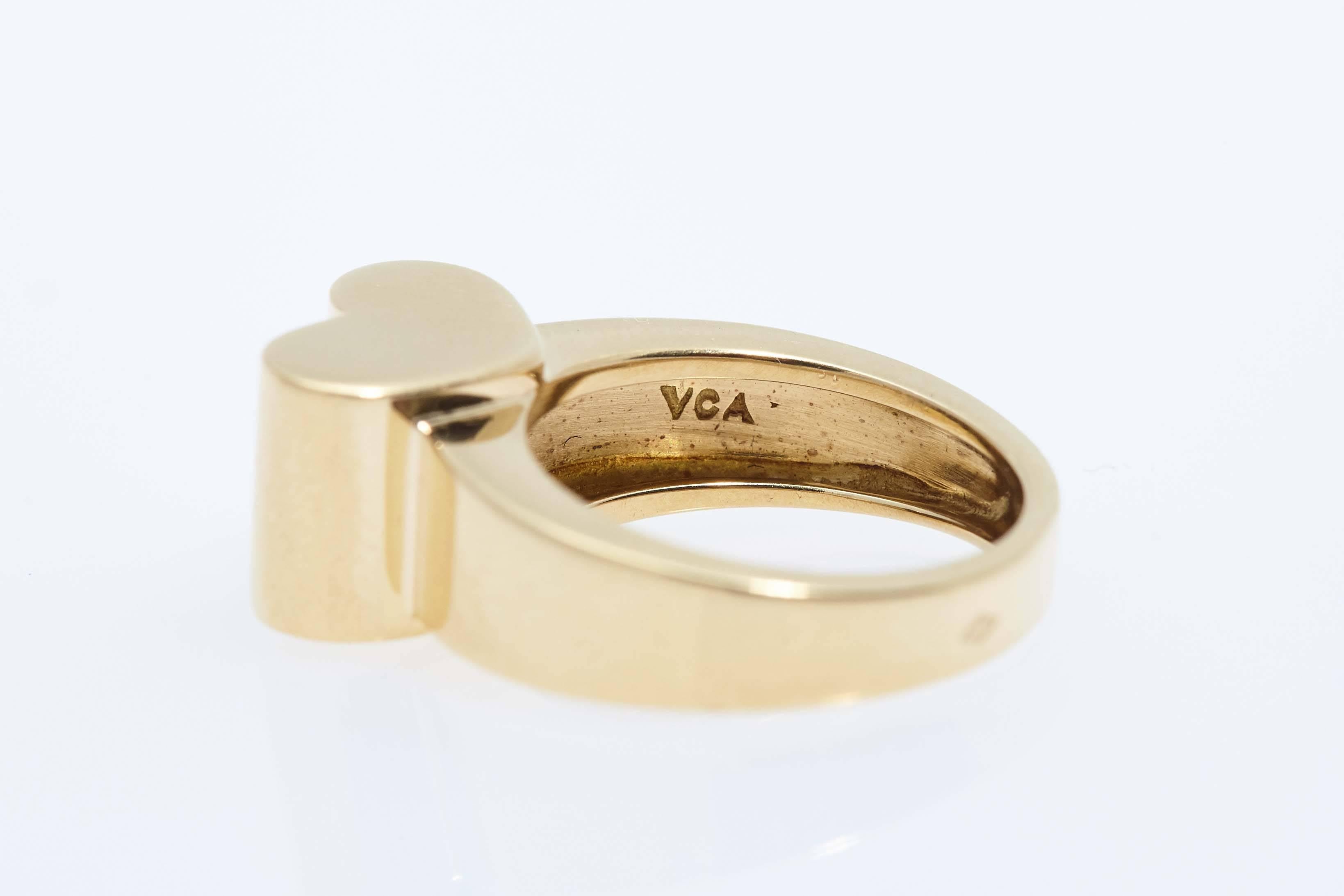 Van Cleef & Arpels eighteen karat yellow gold heart shaped ring with French Hallmarks. The ring measures one inch in height and is size 4 1/4 