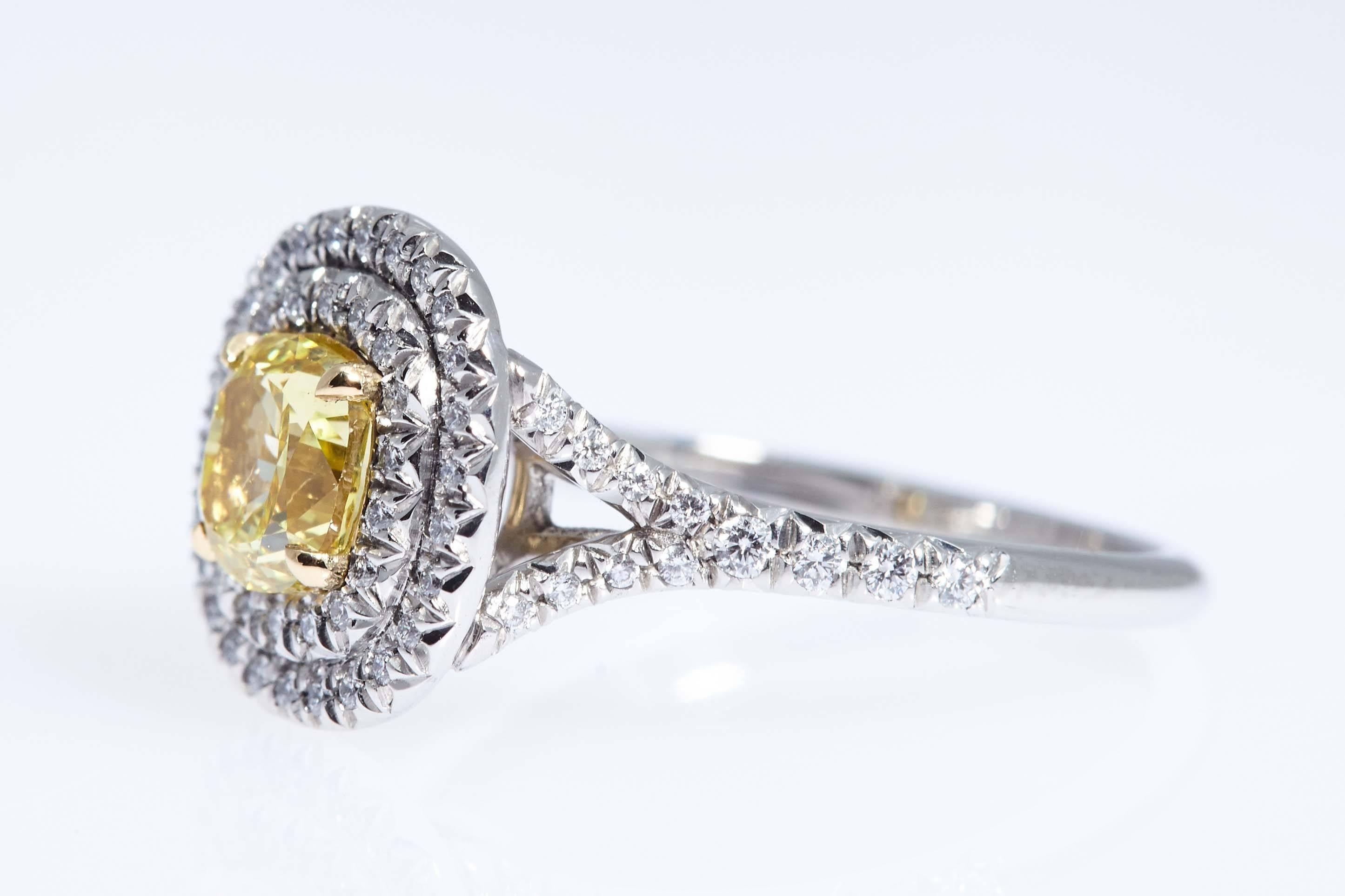 GIA Vivid Yellow Cushion Shaped Diamond Platinum Gold Ring In Excellent Condition For Sale In New York, NY