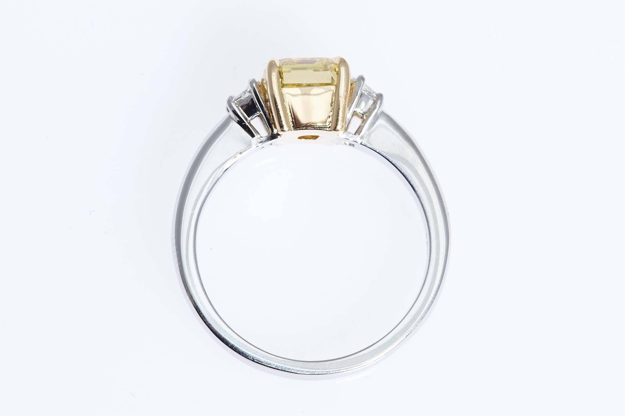 GIA Intense Yellow 1.62 Carat Emerald Cut Diamond Platinum Three-Stone Ring In Excellent Condition For Sale In New York, NY