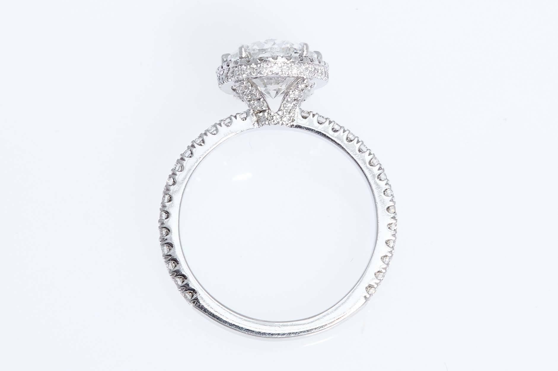 Platinum engagement ring with an Oval shaped diamond in the center weighing 3.01 carats. The oval diamond has a certificate from the Gemological Institute of America stating that it is 