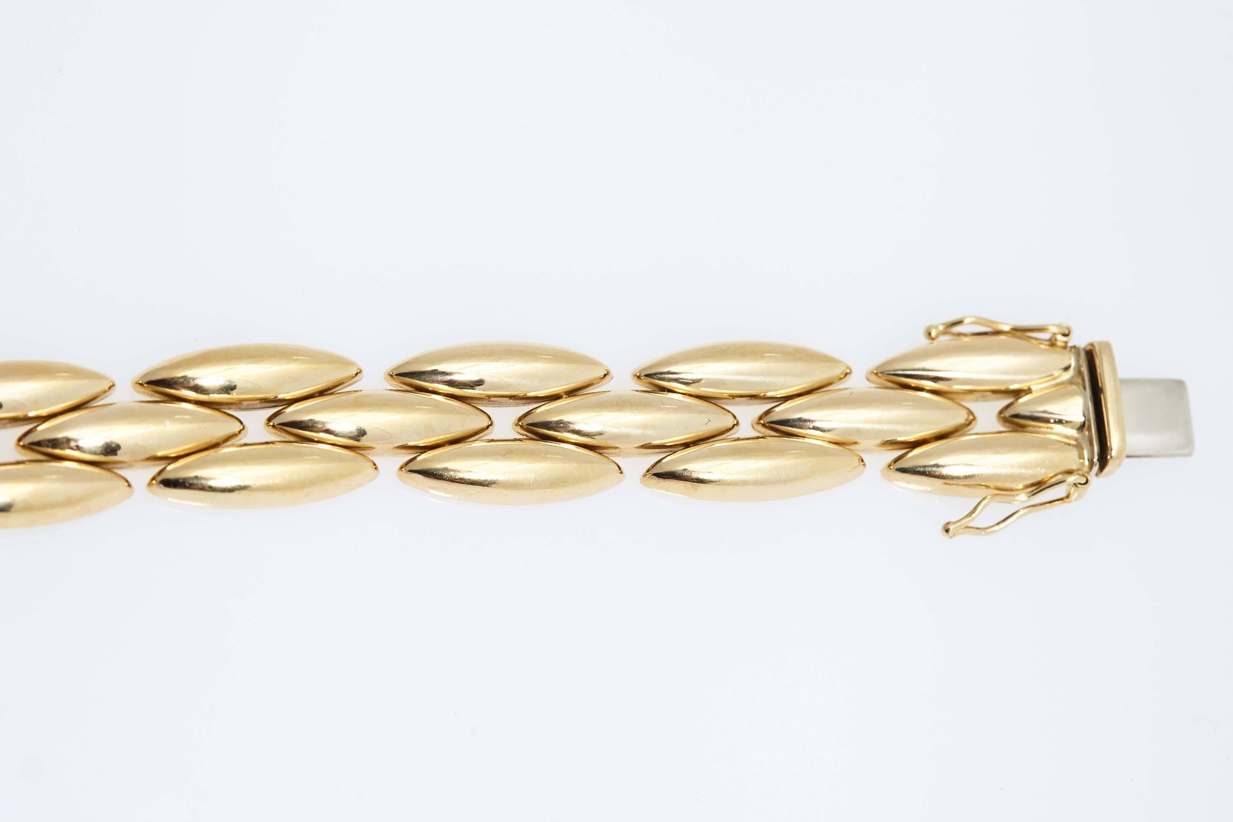 Cartier 18 karat yellow gold flat link chain bracelet. The bracelet is approximately 7.5 inches long and is stamped "Cartier, 750".