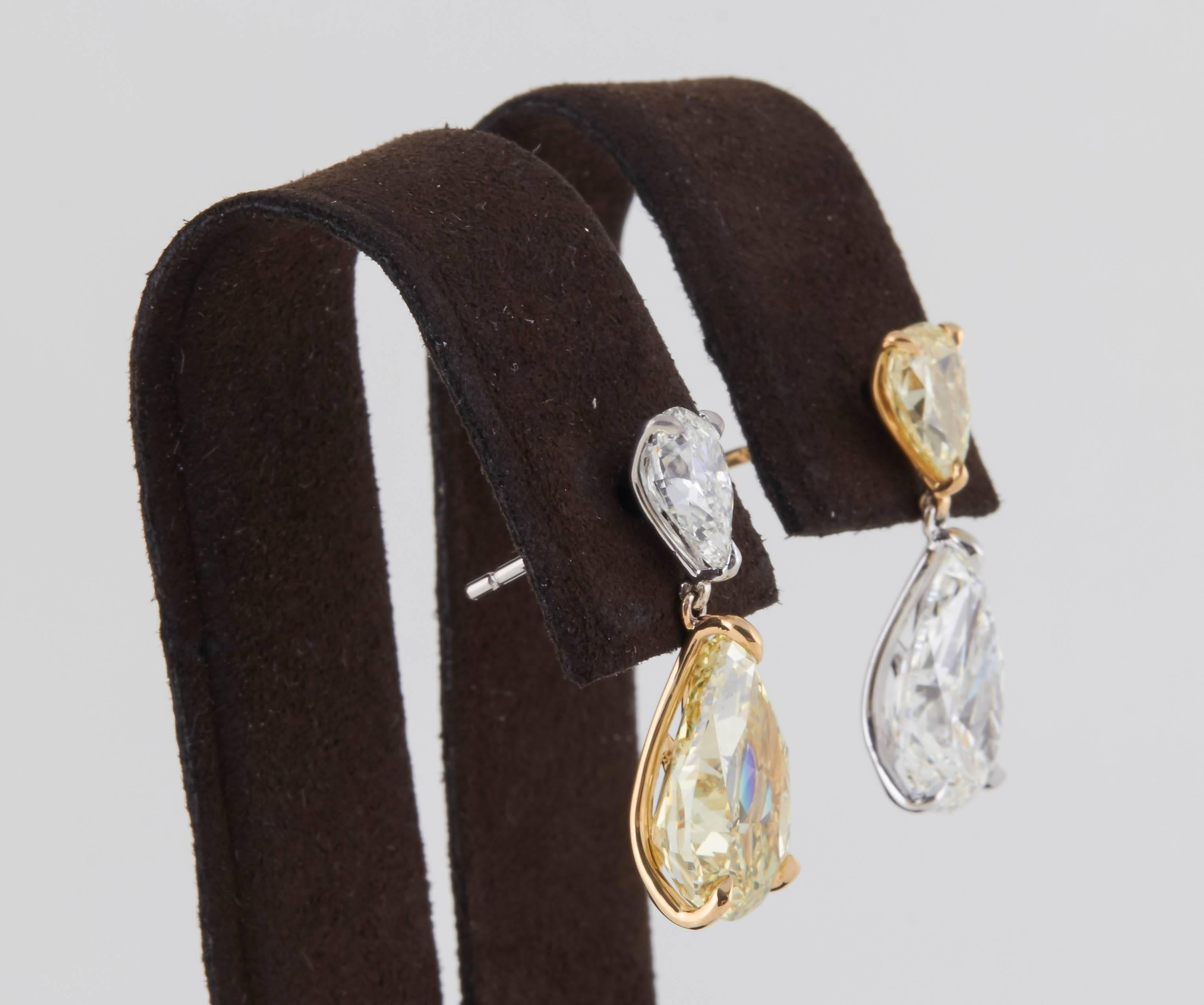 

A unique and beautiful pair of earrings -- a rare find!

Four fabulous pear shaped diamonds -- alternating yellow and white diamond drops.

All 4 diamonds are GIA certified.

6.52 carats of Fancy yellow diamonds, 5.08 carats of white diamonds set