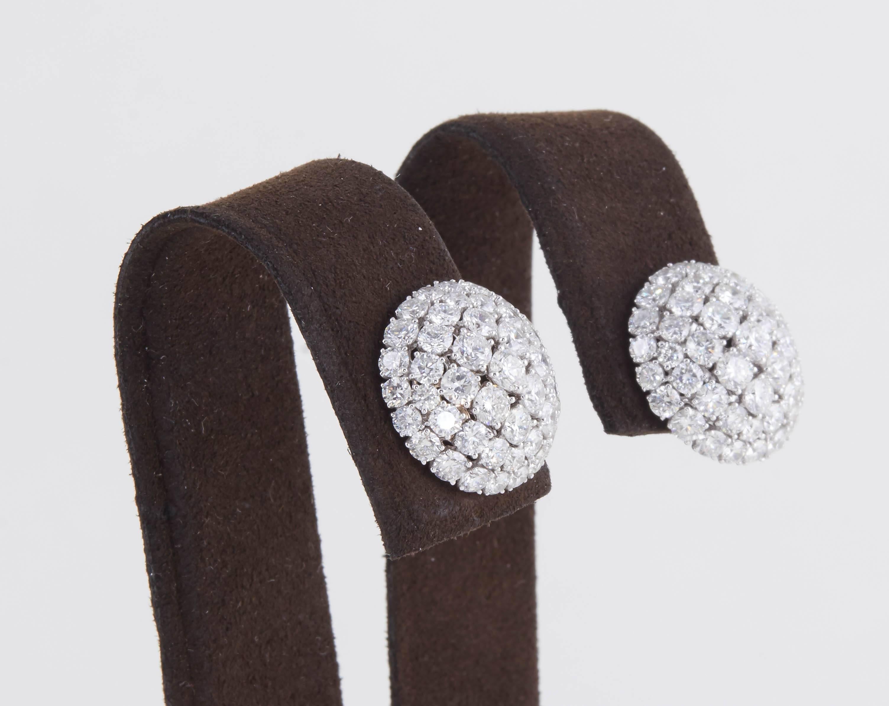 

A must have!

4.83 carats of round brilliant cut diamonds, F/G color set in 18k white gold.

These earrings were constructed to maximize brilliance in a slight dome design. 

Approximately .62 inches in diameter. 

The perfect gift, made in New