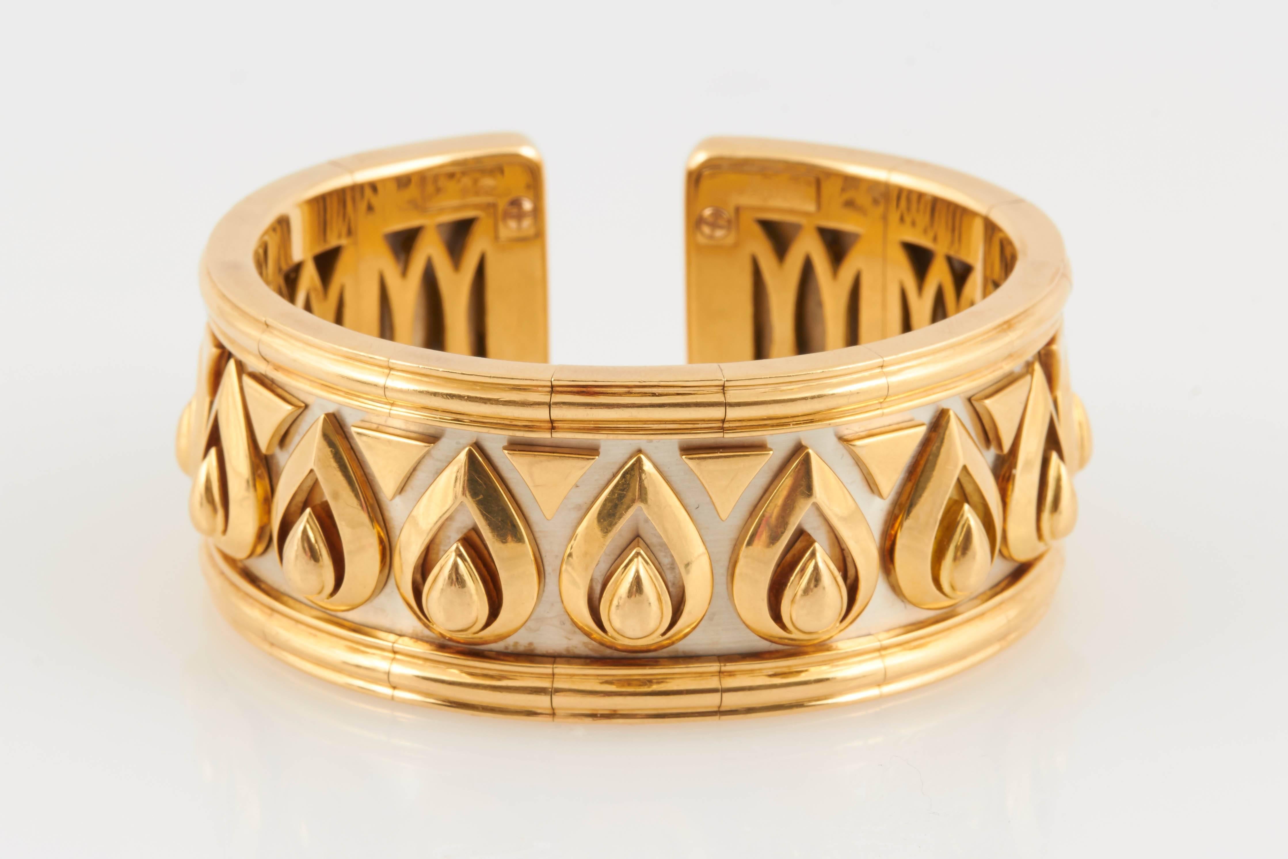 Finely crafted in 18k white and yellow gold.
Signed by Cartier, from their Walking Panthere collection.
Flexible, fits sizes 6 - 7 1/2 inches
1 inch wide