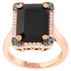 Anillo de cóctel de oro rosa de 14 quilates con ónix negro y halo de diamantes azules y blancos de 1/5 qtw