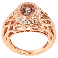 Anillo cóctel halo de oro rosa de 14 quilates con morganita rosa claro y diamantes de 3/8 qt