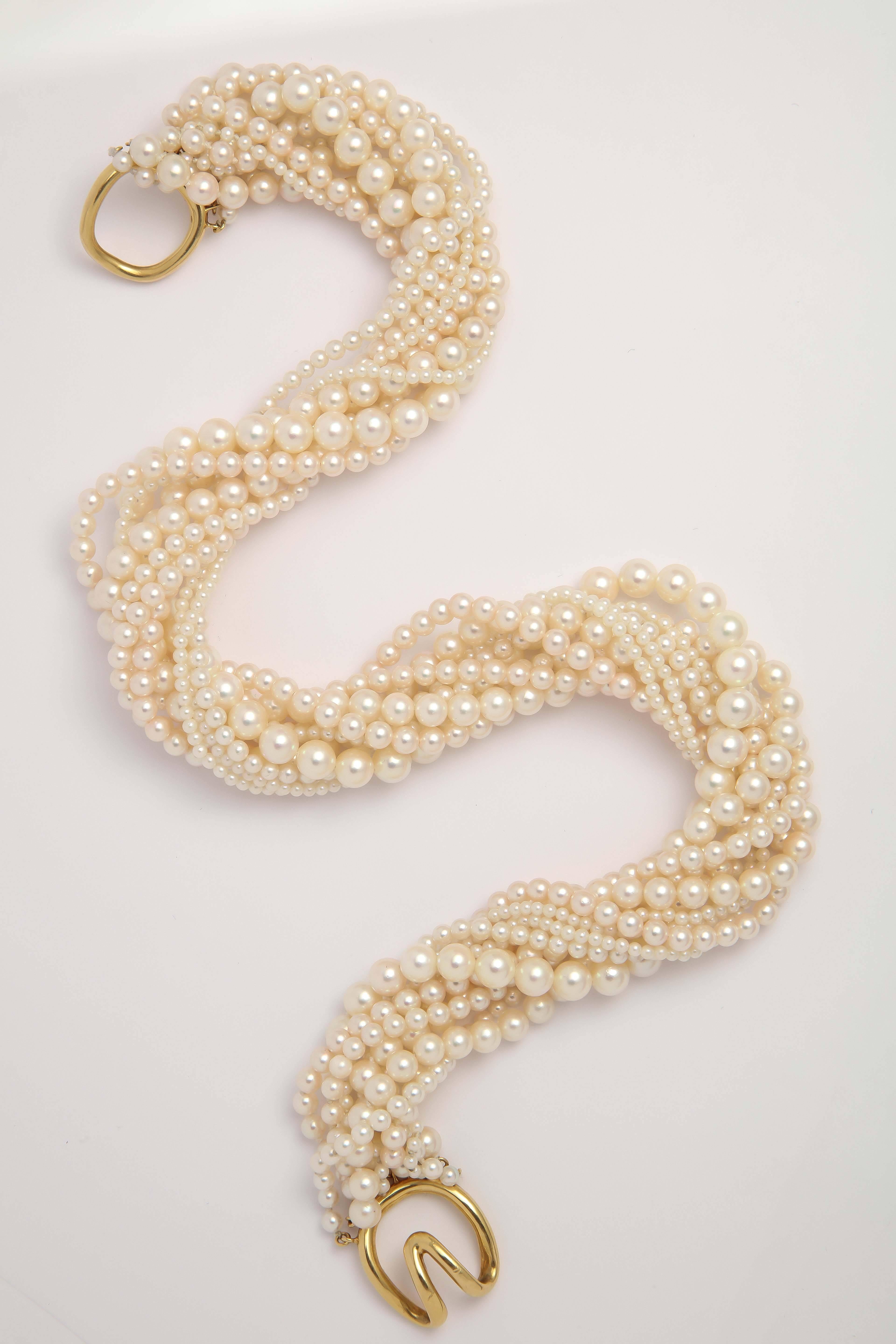 Torsade made up of 10 Strands of cultured Pearls with 18kt Yellow Gold Clasp.
Signed Tiffany & Co.
