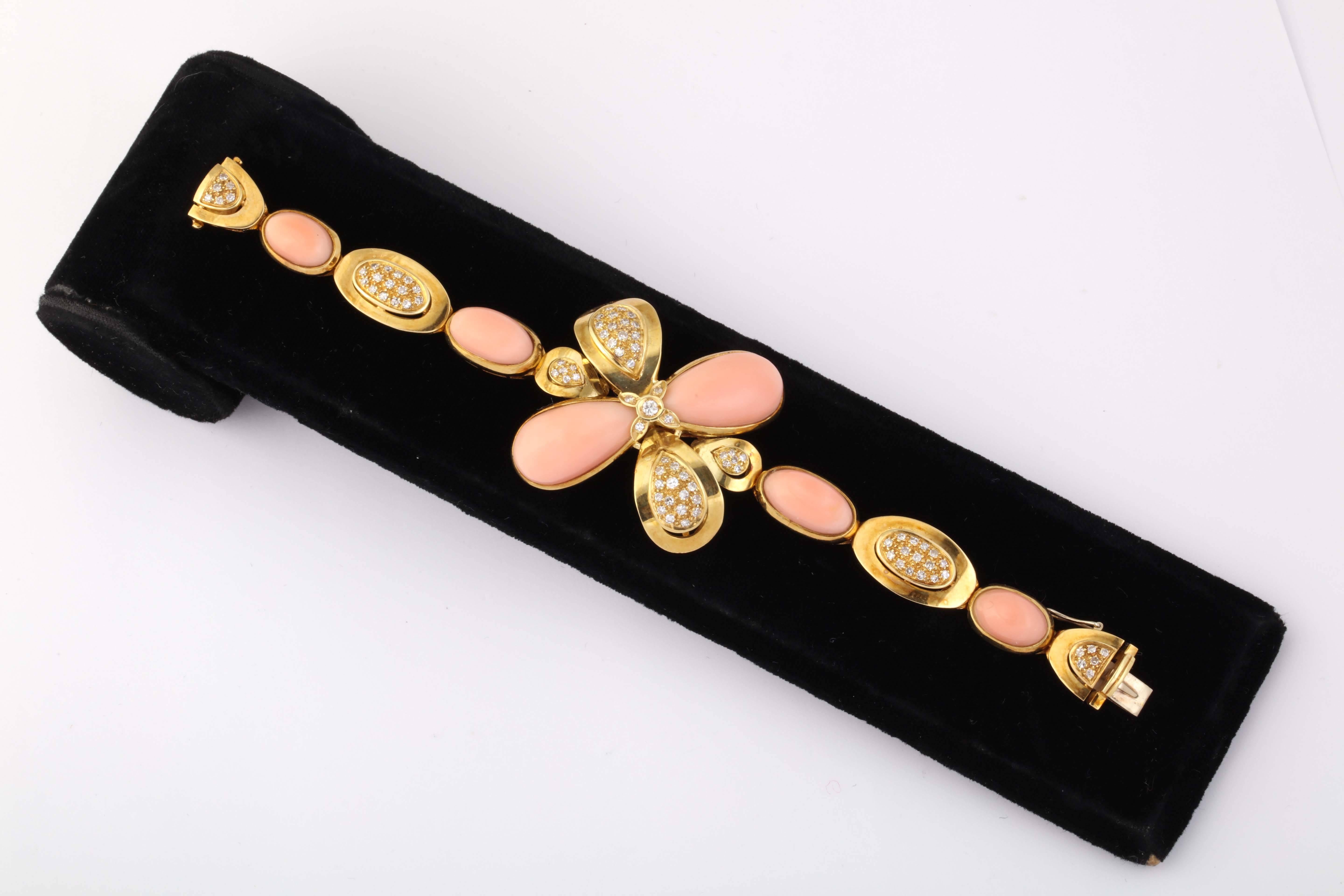 One Ladies Bracelet Composed Of A Large Floret Design In Center Of Piece . Each Angel Skin Coral Approximately 23 mm in length In Each Of The Two Pieces In The Center. The Remaining Four Corals In Link of Bracelet Measuring Approximately 10 Mm Each.