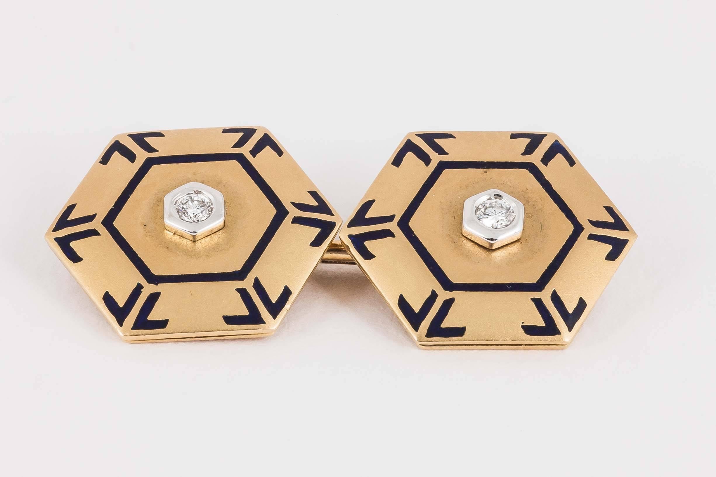 A good quality pair of hexagonal shaped cufflinks,in a soft coloured brushed finish,central diamond centre,with lapis blue enamel decoration.The dividing bar stamped 750,and 1988 Al.probably Italian