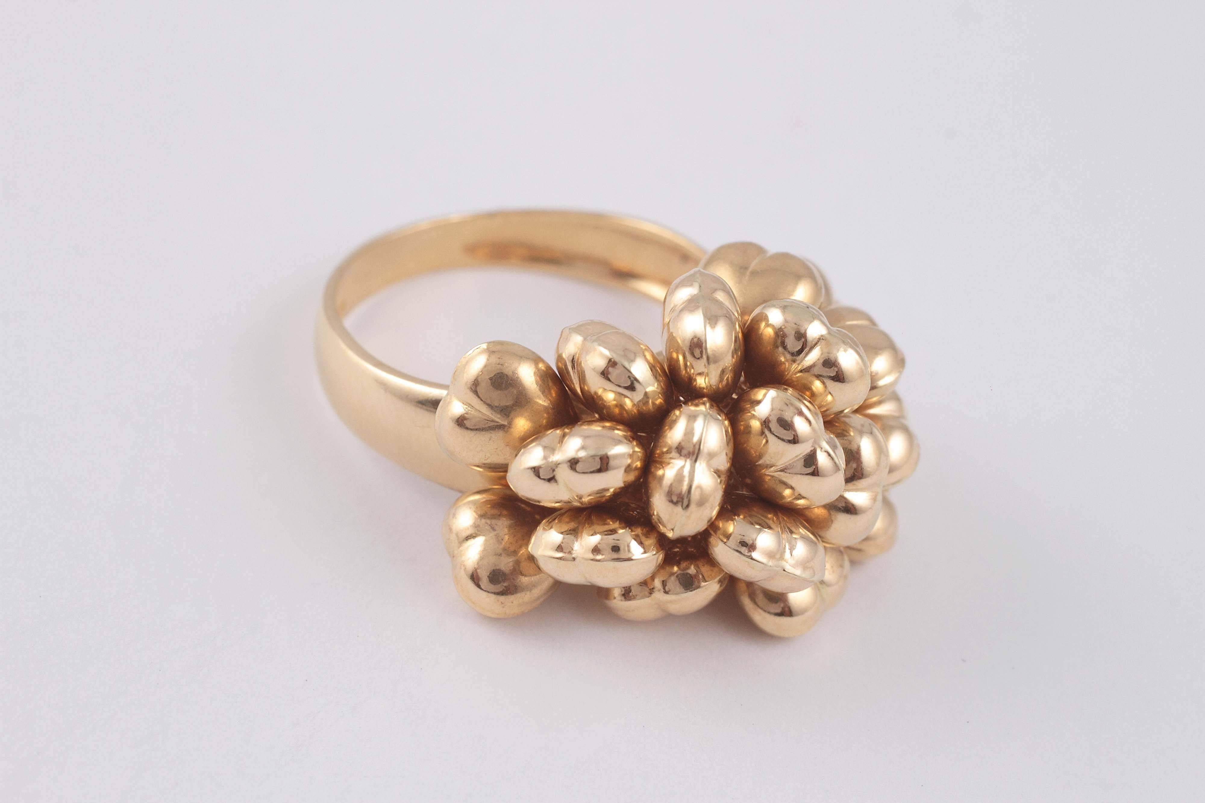 Fun and whimsical - this 18 karat, Italian ring has heart shapes that move with your hand!.  Size 8