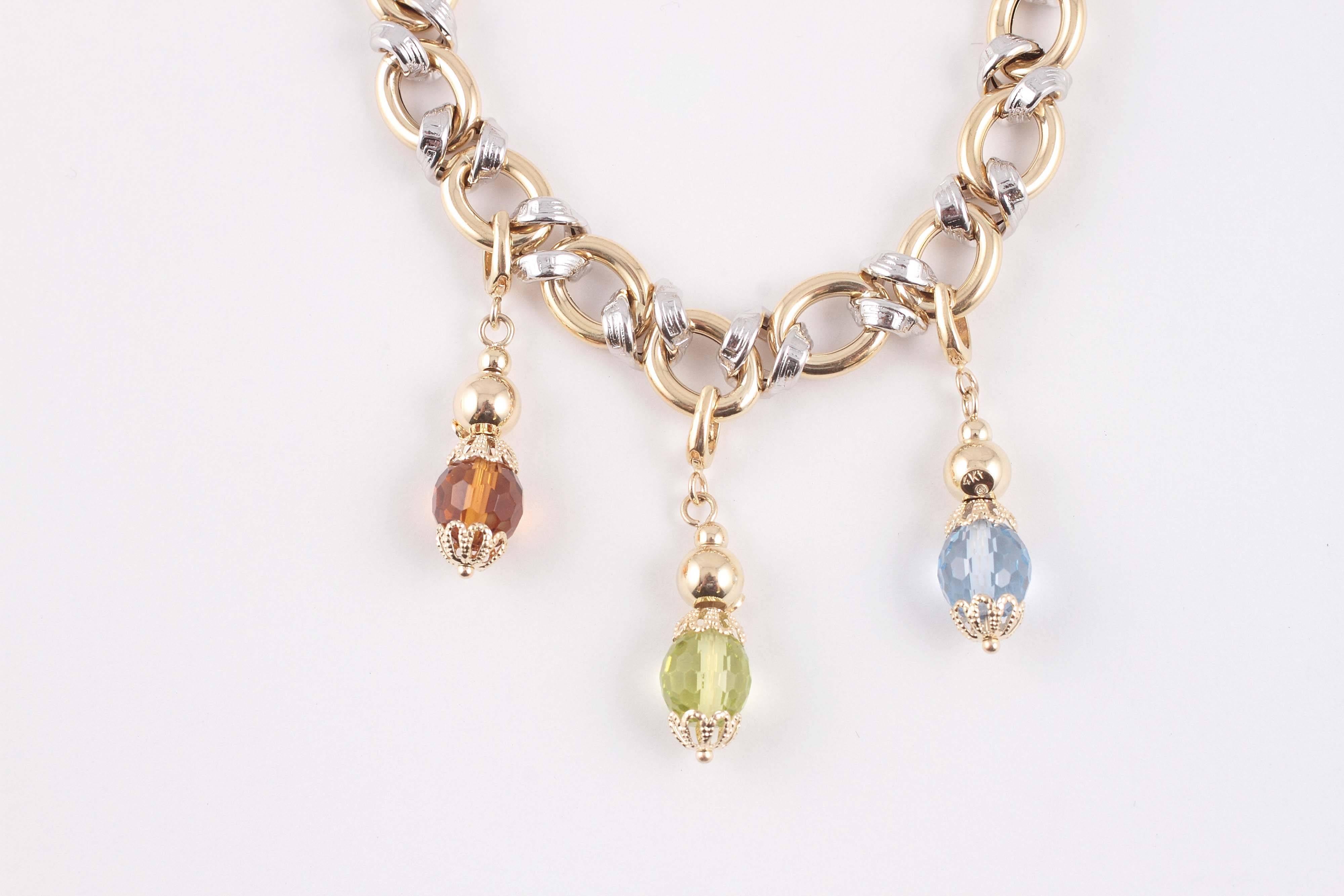 Fun and light, with faceted gemstone drops in Peridot, Citrine and Topaz!  7 1/4
