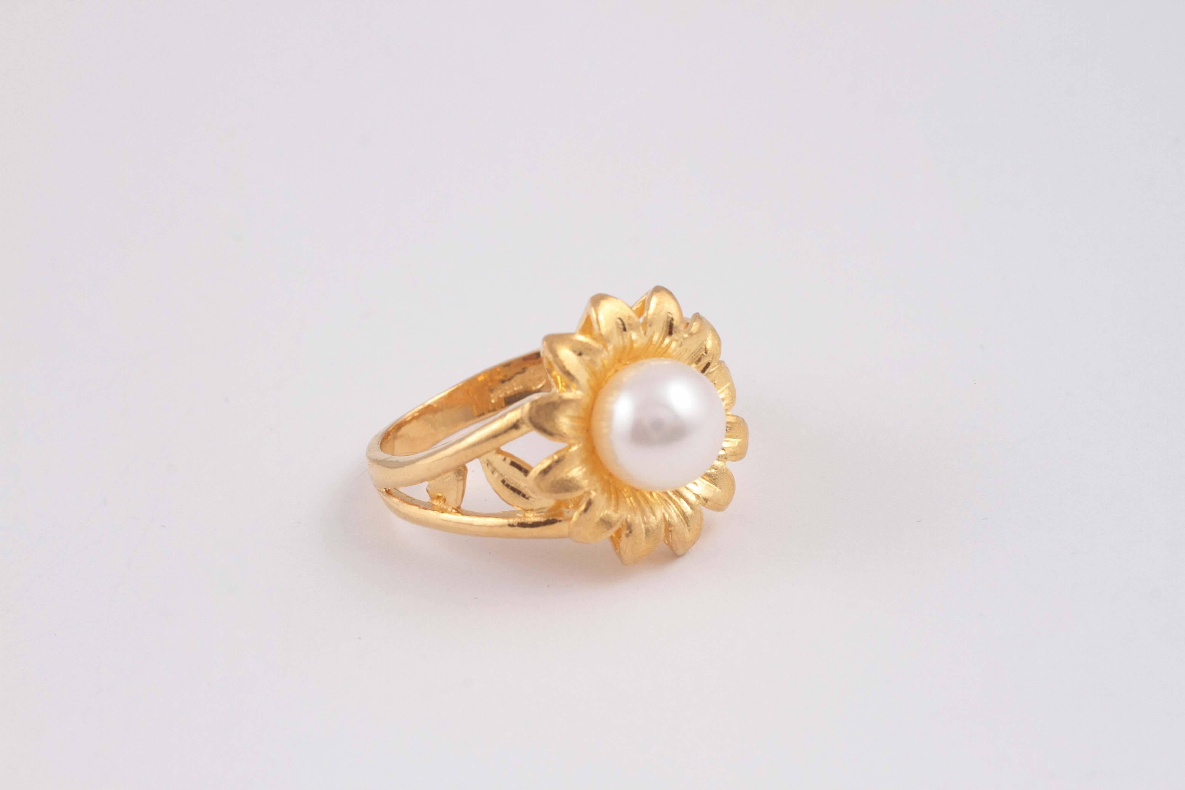 Centered with a 8.15 mm, cultured pearl, this flower ring is lovely!  Size 8 1/4.