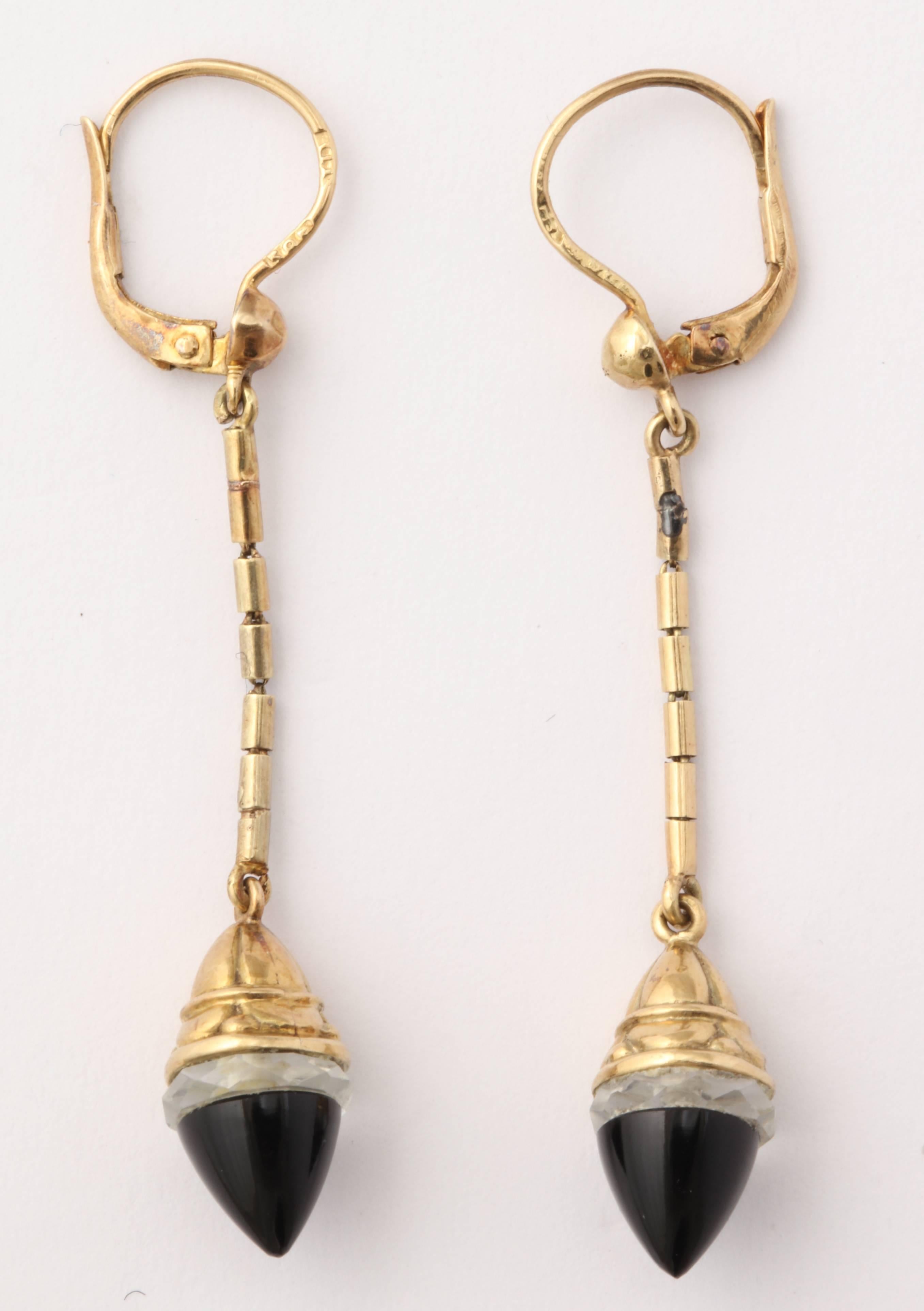 Lightweight and easy to wear, these earrings are a perfect example of Victorian jewelry working so well in the modern day. Flexible yellow gold with torpedo drops of rock crystal and onyx tips. 